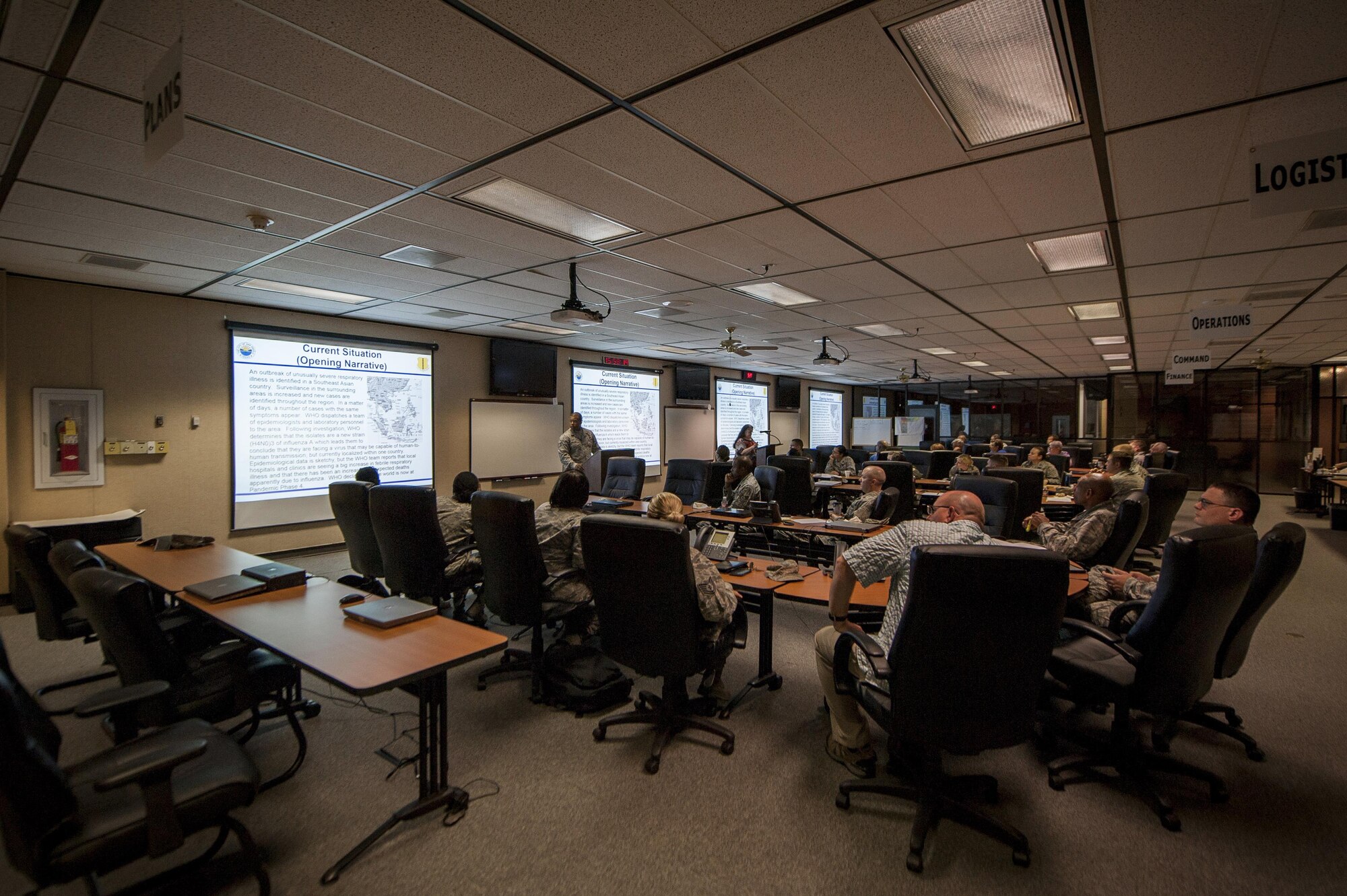 Members of Goodfellow Air Force Base and the San Angelo Community discuss plans during the pandemic flu table top exercise at the San Angelo Emergency Management Center Sept. 24, 2015. The exercise team consisted of medical, first responders   and emergency management personnel.
