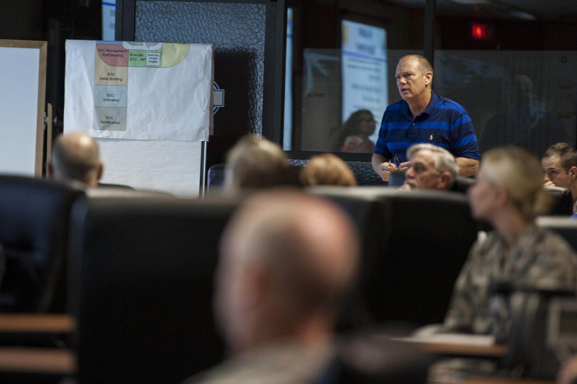 Wayne L. Click, 17th Civil Engineer Squadron Readiness and Emergency Management, speaks to the exercise team during the pandemic flu table top exercise at the San Angelo Emergency Management Center Sept. 24, 2015. The exercise team consisted of medical, first responders   and emergency management personnel.