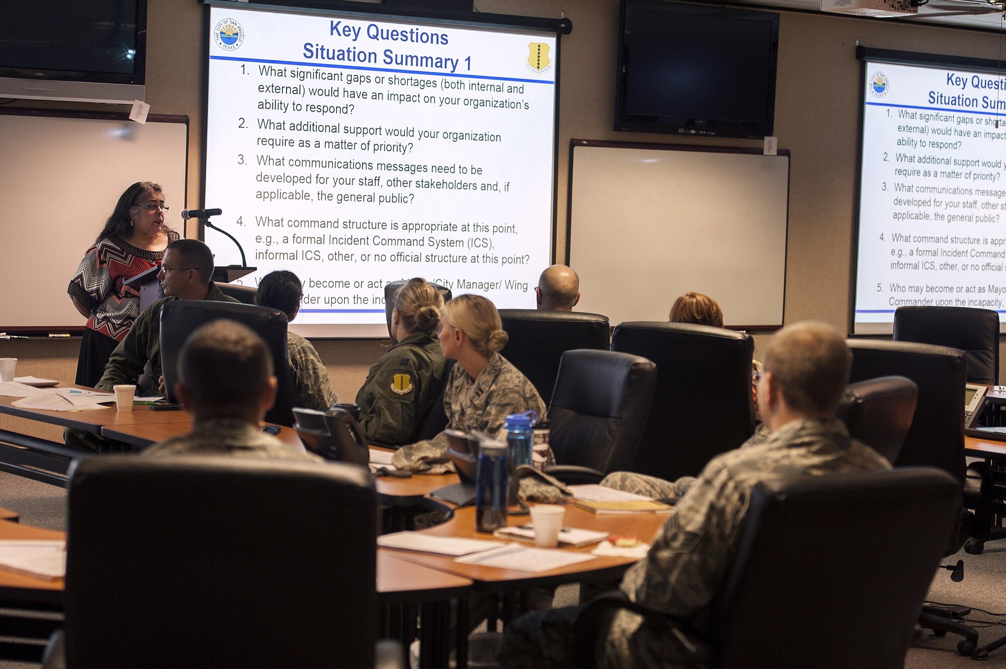 Sandra Villarreal, City County Health Department health director, displays scenarios during the pandemic flu table top exercise at the San Angelo Emergency Management Center Sept. 24, 2015. The exercise consisted of members of Goodfellow Air Force Base and the San Angelo Community working together to plan for a flu pandemic.