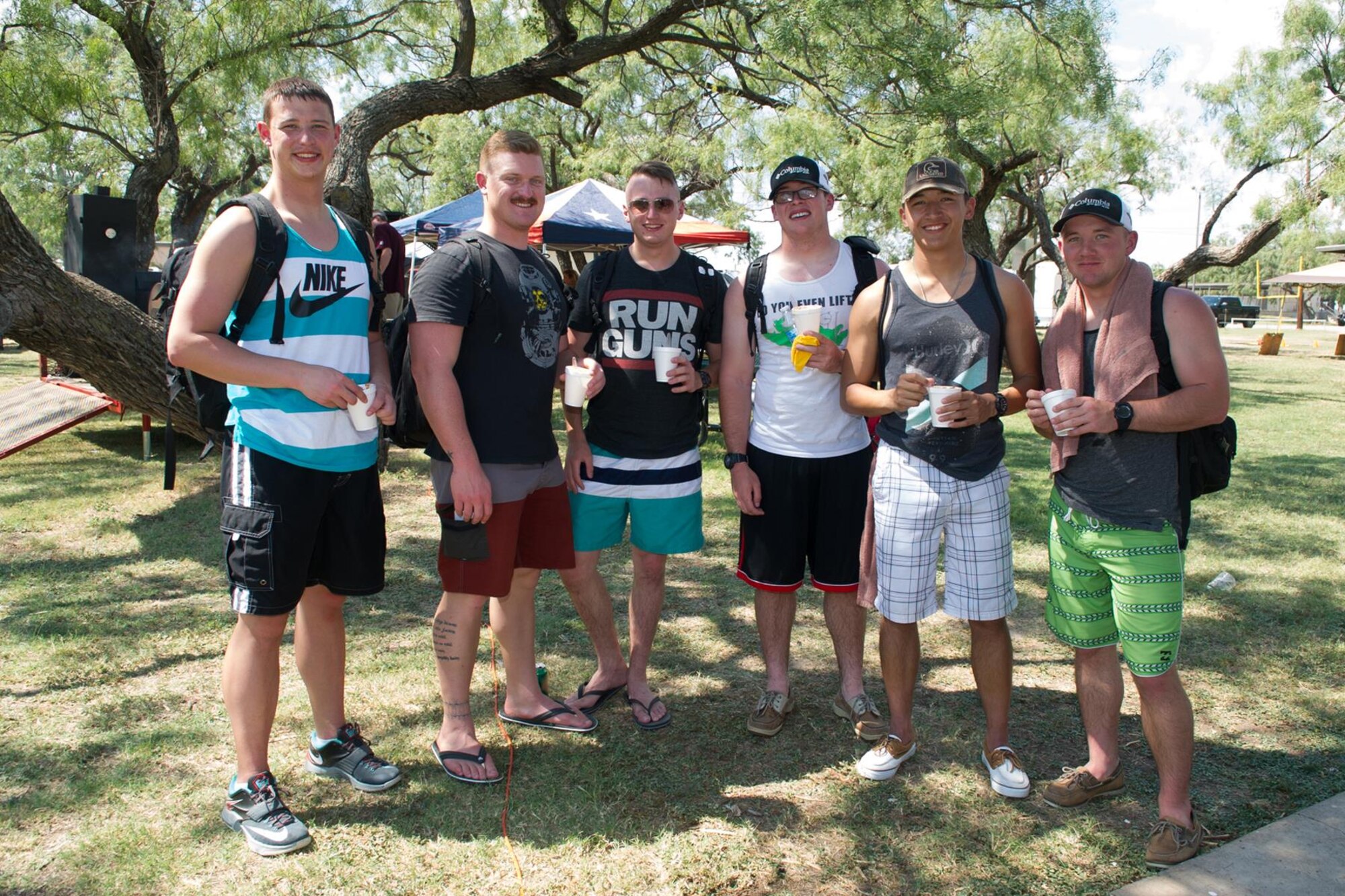 Students from the 315th Training Squadron pose for a photo after sampling some of the chili during the 42nd Annual Armed Forces Chili Cook-off at the Goodfellow Air Force Base Recreation Camp, San Angelo, Texas, Sept. 26, 2015. Spectators sampled food by obtaining tasting cups at the event and then voted for their favorite, which received the People's Choice Award. (U.S. Air Force photo by Staff Sgt. Laura R. McFarlane/Released)