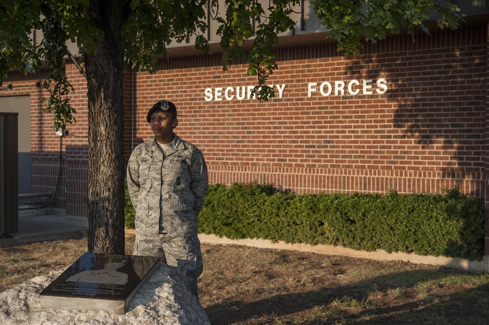 U.S. Air Force Senior Airman Reece A. Lauren, 17th Security Forces Squadron combat arms instructor, watches over a memorial for Airman 1st Class Elizabeth Jacobson during the 10th Annual Airman 1st Class Jacobson Memorial Ruck March at the 17th Security Forces Squadron building Sept. 29, 2015. Jacobson was the first security forces member as well as the first Air Force female to be killed in action in Operation Iraqi Freedom, in 2005, by a roadside bomb. (U.S. Air Force photo by Staff Sgt. Michael Smith/Released)