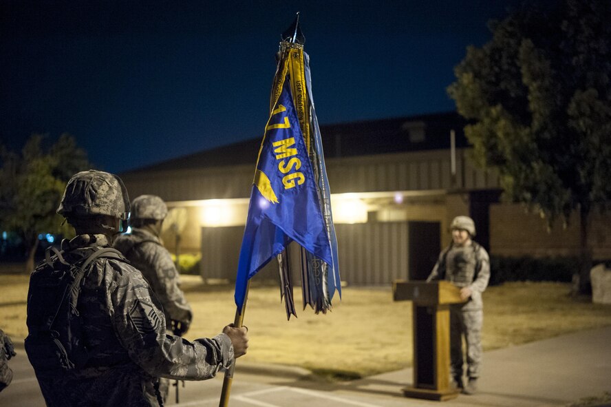 U.S. Air Force Master Sgt. Steven D. Thompson, 17th Security Forces Squadron first sergeant, holds the 17th Mission Support Group guidon during the 10th Annual Airman 1st Class Jacobson Memorial Ruck March opening ceremony at the 17th SFS building Sept. 28, 2015. The march was in honor of security forces member Airman 1st Class Elizabeth Jacobson, and marked the 10th anniversary of her death. Jacobson was the first security forces member as well as the first Air Force female to be killed in action in Operation Iraqi Freedom, in 2005, by a roadside bomb. (U.S. Air Force photo by Staff Sgt. Michael Smith/Released)