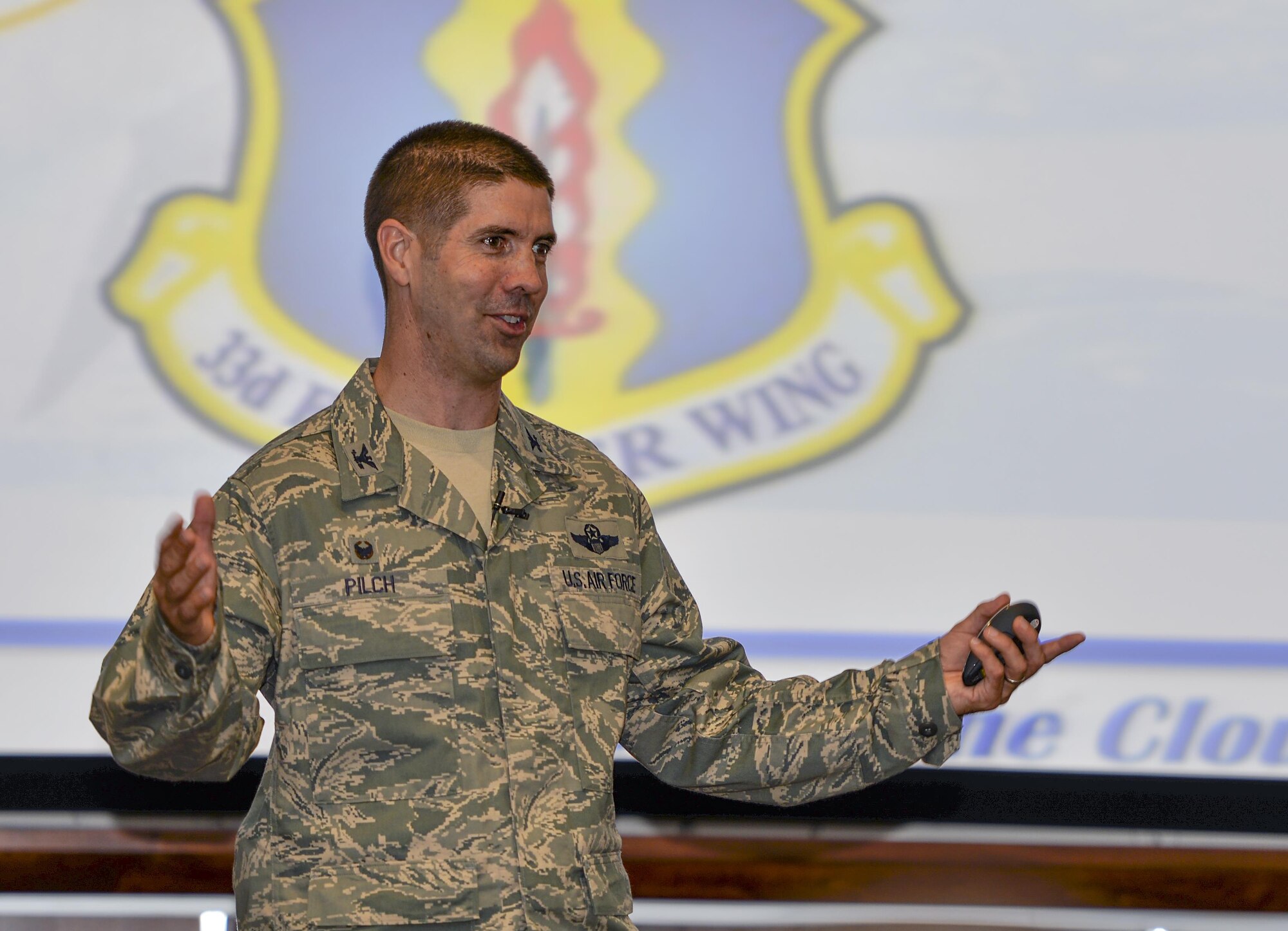 Col. Lance Pilch, 33rd Fighter Wing commander, discusses the importance of striking a balance between home and work life while maintaining professionalism on the job with Airmen during a commander’s call at Eglin Air Force Base, Fla., Sept. 11, 2015. Pilch expressed how these two factors are linked to the 33rd FW’s successful accomplishment of the overall F-35 program mission. (U.S. Air Force Photo/Senior Airman Andrea Posey) 