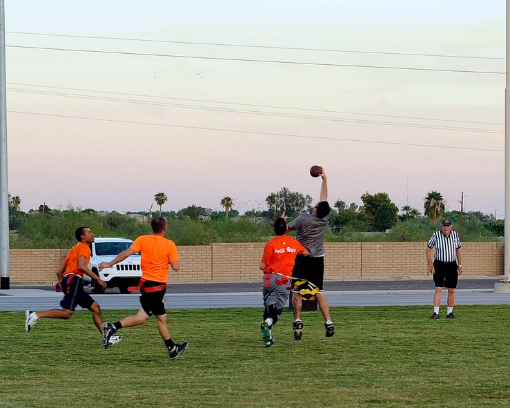 Tech. Sgt. Steve Martin, 372nd Training Squadron fuels systems instructor, catches a pass with one hand for a huge gain Sept. 28, 2015, at Luke Air Force Base, Ariz. The 372nd TRS lost to the 56th Component Maintenance Squadron 37-0. (U.S. Air Force photo by Airman Pedro Mota)