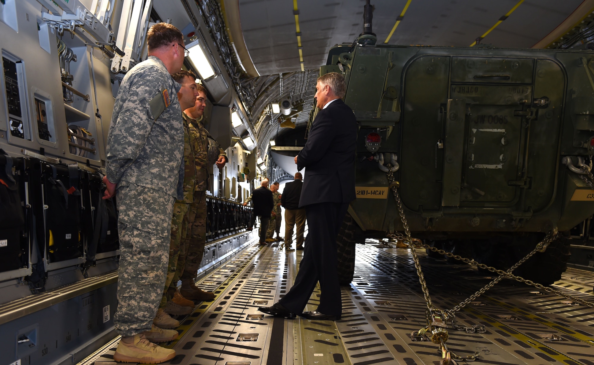 A group of Soldiers from the 1st Squadron 14th U.S. Cavalry out of the 7th Infantry Division Joint Base Lewis-McChord brief a member of the National Commission of the Future of the Army inside a C-17 Globemaster III on the McChord Field flight line, Sept. 25, 2015, at Joint Base Lewis-McChord, Wash. The Soldiers were giving insight to Army capabilities here at JBLM and the partnership with the Air Force to better inform the NCFA.(U.S. Air Force photo/Senior Airman Naomi Griego)