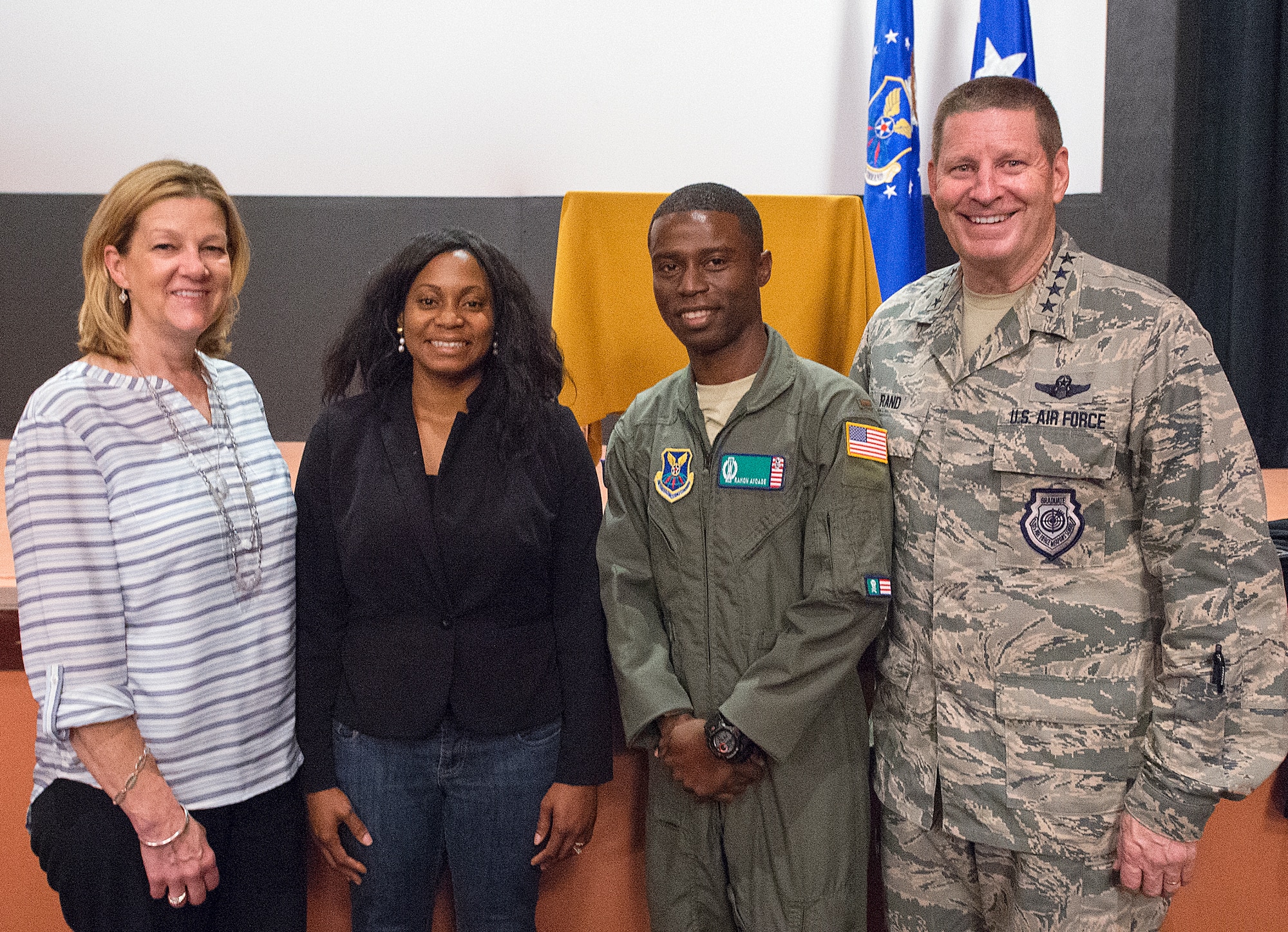 Gen. Robin Rand, Air Force Global Strike commander, and his wife Kim, pose with 2nd Lt. Ramon Ayoade, 321st Missile Squadron, and his wife Tolu, following an all-call on F.E. Warren Air Force Base, Wyo., Sept. 23, 2015. Rand recognized the Ayoade as someone whose background and experience benefits the Air Force. (U.S. Air Force photo by R.J. Oriez)