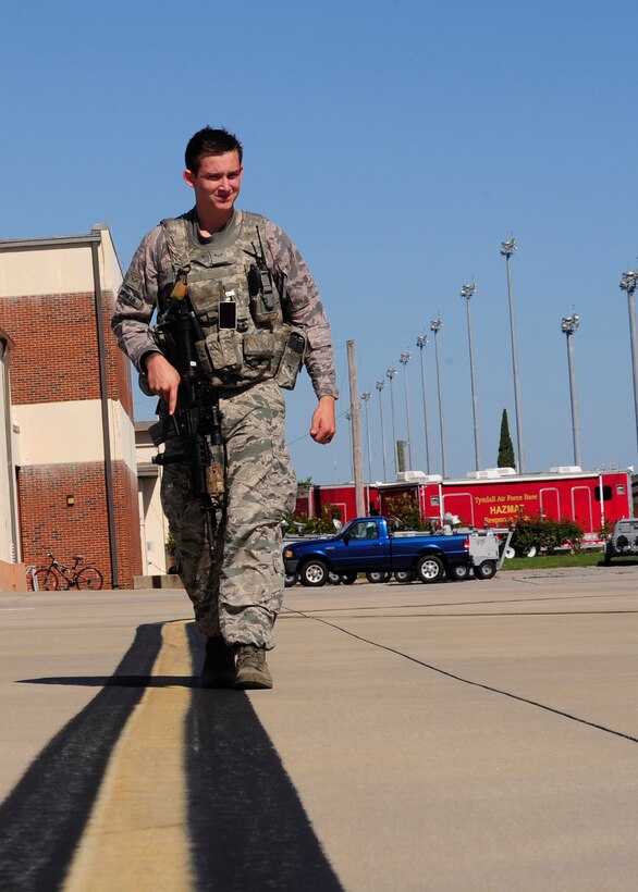 Airman 1st Class Tyler Dingman, 325th Security Forces Squadron response force member, patrols the flight line Sept. 14 ensuring the security and safety of equipment and personnel. The 325th Security Forces Squadron is one of six squadrons assigned to the 325th Mission Support Group, 325th Fighter Wing, Tyndall Air Force Base, Fla. The squadron provides force protection programs to include weapon system security, police services, resource protection and antiterrorism for a 29,000-acre base with 128 miles of shoreline in support of 325th FW and 30 associate units. The squadron oversees personnel, information, and industrial security procedures for more than 6,700 assigned personnel. The 325th SFS also maintains a wartime and contingency rapid deployment capability to conduct force protection operations worldwide. (U.S. Air Force photo by Airman 1st Class Solomon Cook/Released)