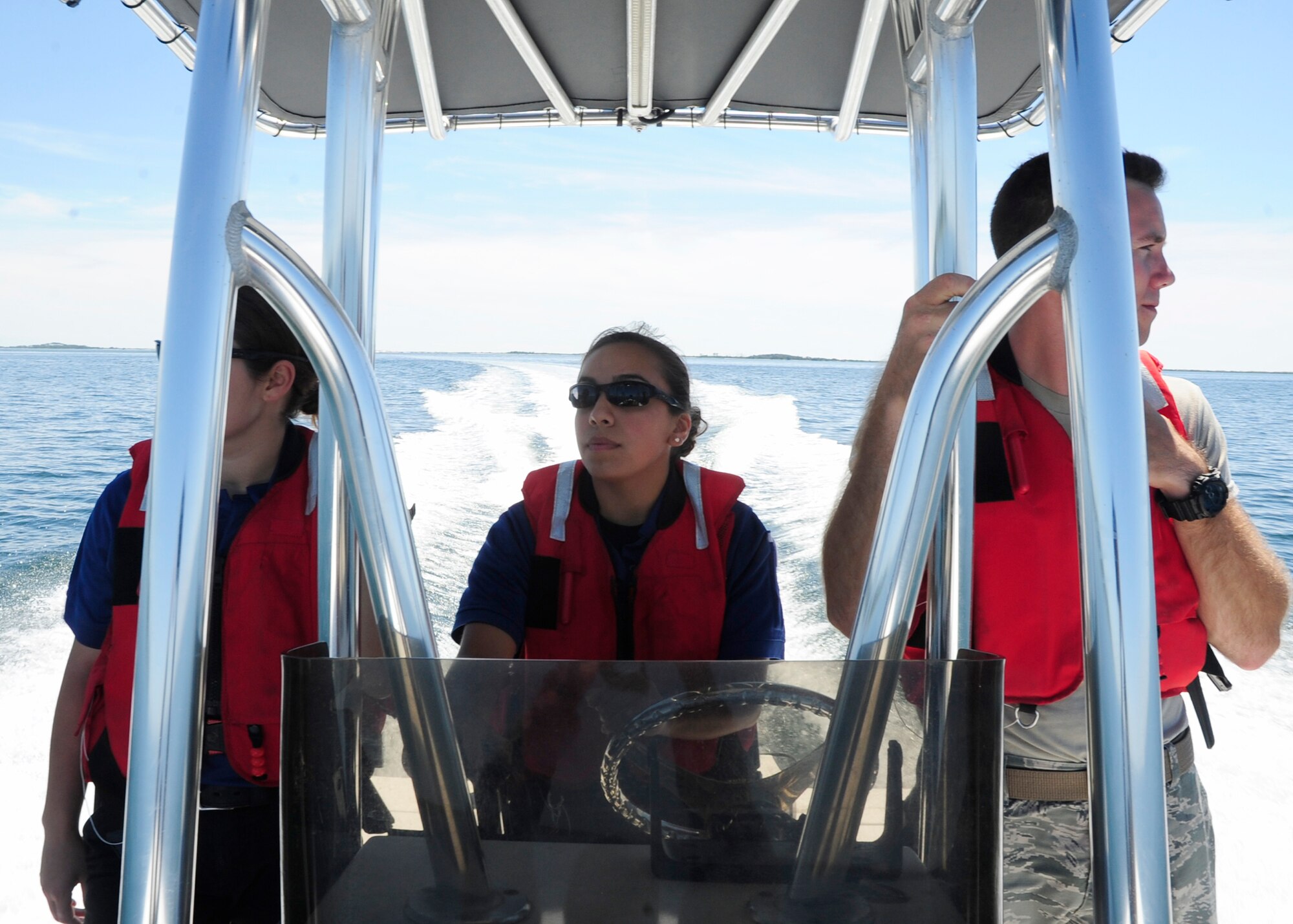 Senior Airman Abigail Sanchez, 325th Security Forces Squadron community police member drives a patrol boat Sept. 14 along the Tyndall coastline. The 325th Security Forces Squadron is one of six squadrons assigned to the 325th Mission Support Group, 325th Fighter Wing, Tyndall Air Force Base, Fla. The squadron provides force protection programs to include weapon system security, police services, resource protection and antiterrorism for a 29,000-acre base with 128 miles of shoreline in support of 325th FW and 30 associate units. The squadron oversees personnel, information, and industrial security procedures for more than 6,700 assigned personnel. The 325th SFS also maintains a wartime and contingency rapid deployment capability to conduct force protection operations worldwide. (U.S. Air Force photo by Airman 1st Class Solomon Cook/Released)

