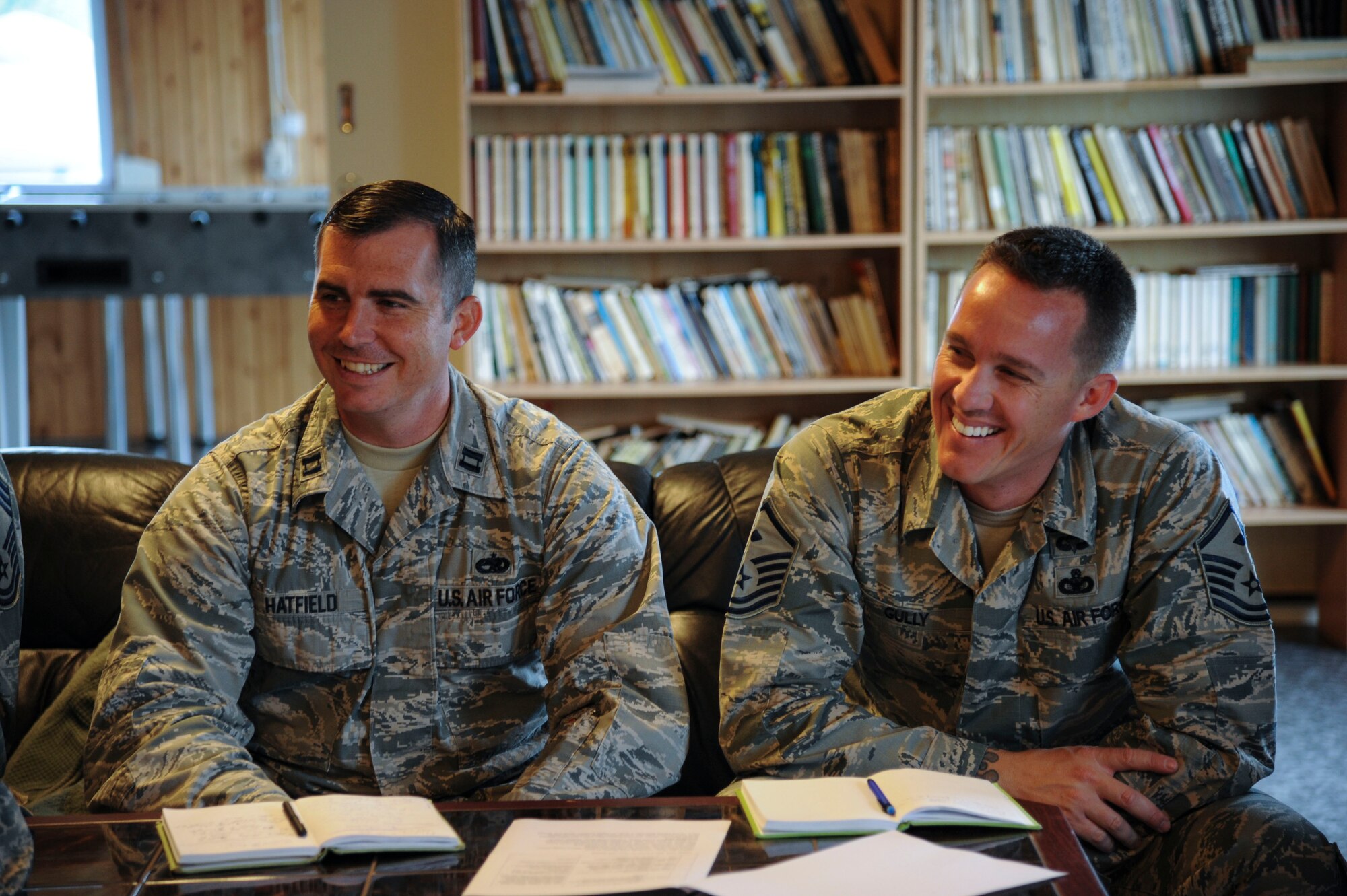 U.S. Air Force Capt. Adam Hatfield, 74th Expeditionary Fighter Squadron Maintenance officer-in-charge, and Master Sgt. Joe Gully, 74th EFS first sergeant, share a laugh during a morale and welfare meeting at Amari Air Base, Estonia, Sept 28, 2015. Both Hatfield and Gully attend weekly meetings with Estonian air force leadership to discuss different opportunities for 74th EFS Airmen who are deployed as part of a theater security package.  (U.S. Air Force photo by Andrea Jenkins/Released)