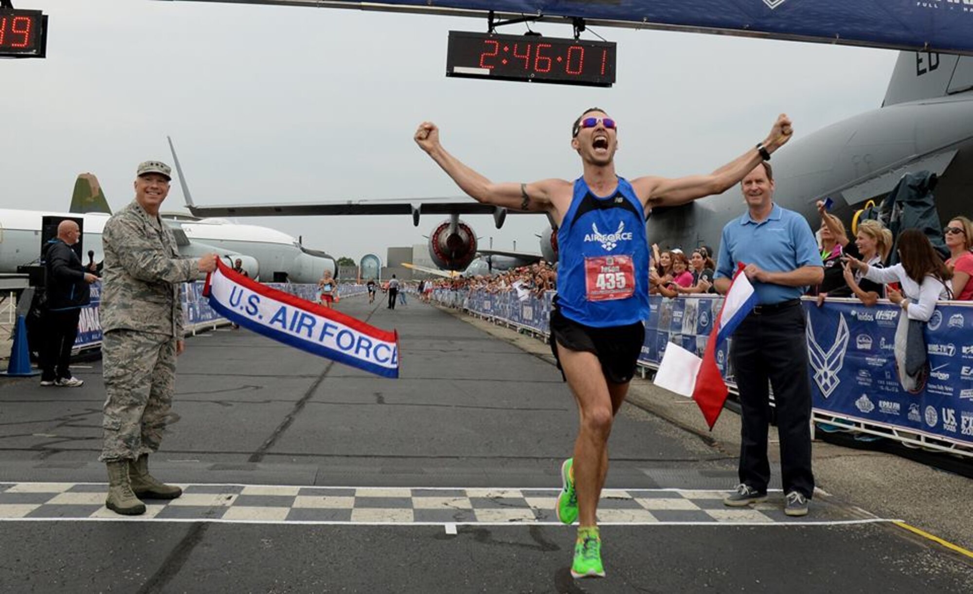 PETERSON AIR FORCE BASE, Colo. - Capt. Jason Brosseau crosses the finish line in first place at the 2015 Air Force Marathon with an overall time of 2:46:01. Brosseau credits not only the many runners who encouraged him to get closer, but also his teammates at the Advanced Space Operations School. (Courtesy photo/Wes Farnsworth)