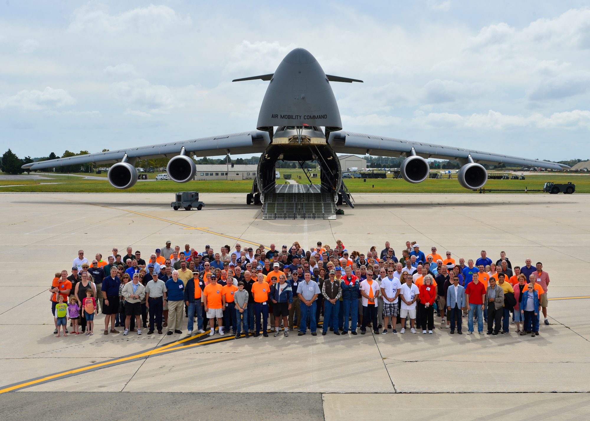 Current and former members of the 9th Airlift Squadron pose for a group photo in front of a C-5M Super Galaxy during the 9th AS 75th Anniversary Reunion Sept. 26, 2015, at Dover Air Force Base, Del. The reunion included a golf tournament, block party, plane pull and an anniversary banquet. (U.S. Air Force photo/Senior Airman Class William Johnson) 