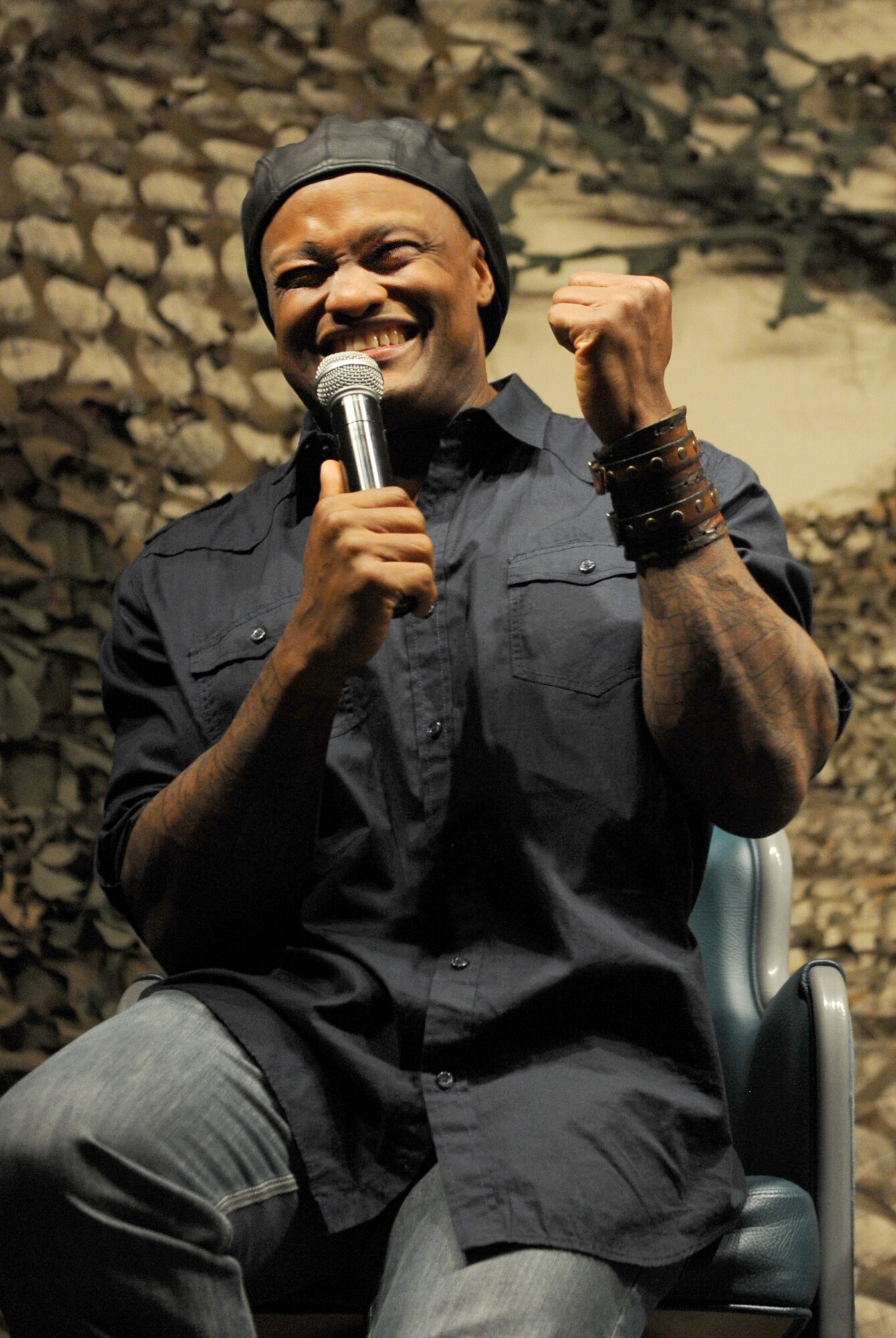 Eljaye Montenegro performs at the Jimmy Doolittle Center at Minot Air Force Base, N.D. Sept. 26, 2015. Montenegro is part of the GIs of Comedy who travel to different bases and locations all over the world to perform troops. (U.S. Air Force photo by Staff Sgt. Chad Trujillo) 