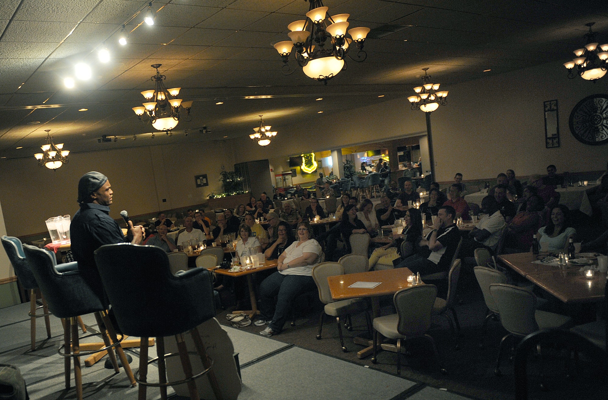 Eljaye Montenegro performs at the Jimmy Doolittle Center at Minot Air Force Base, N.D. Sept. 26, 2015. Montenegro is part of the GIs of Comedy who travel to different bases and locations all over the world to perform troops. (U.S. Air Force photo by Staff Sgt. Chad Trujillo) 