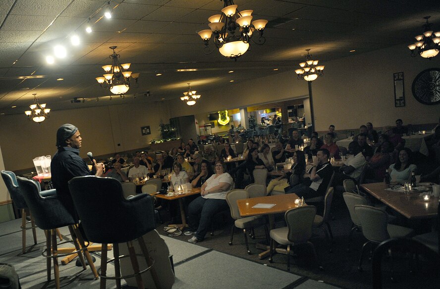 Eljaye Montenegro performs at the Jimmy Doolittle Center at Minot Air Force Base, N.D. Sept. 26, 2015. Montenegro is part of the GIs of Comedy who travel to different bases and locations all over the world to perform troops. (U.S. Air Force photo by Staff Sgt. Chad Trujillo) 