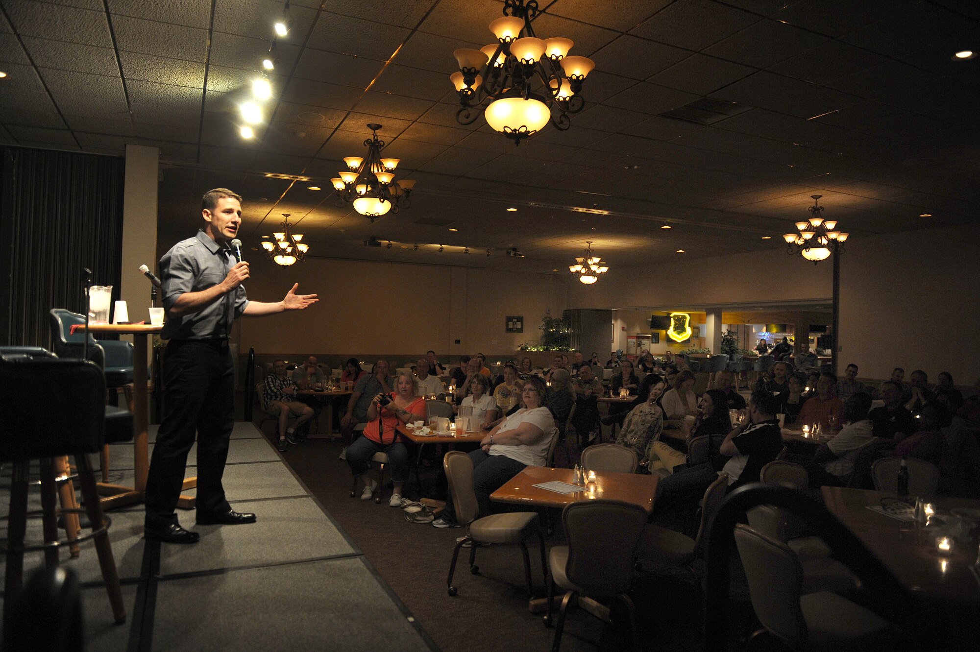 Jose Sarduy performs at the Jimmy Doolittle Center at Minot Air Force Base, N.D. Sept. 26, 2015. Sarduy is part of the GIs of Comedy who travel to different bases and locations all over the world to perform for troops. (U.S. Air Force photo by Staff Sgt. Chad Trujillo) 