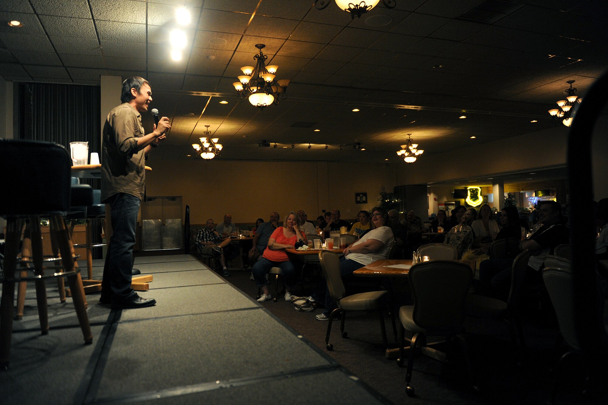 Thom Tran performs at the Jimmy Doolittle Center at Minot Air Force Base, N.D. Sept. 26, 2015. Tran is part of the GIs of Comedy who travel to different bases and locations all over the world to perform for troops. (U.S. Air Force photo by Staff Sgt. Chad Trujillo) 
