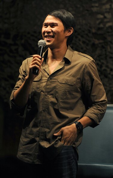 Thom Tran performs at the Jimmy Doolittle Center at Minot Air Force Base, N.D. Sept. 26, 2015. Tran is part of the GIs of Comedy who travel to different bases and locations all over the world to perform for troops. (U.S. Air Force photo by Staff Sgt. Chad Trujillo) 