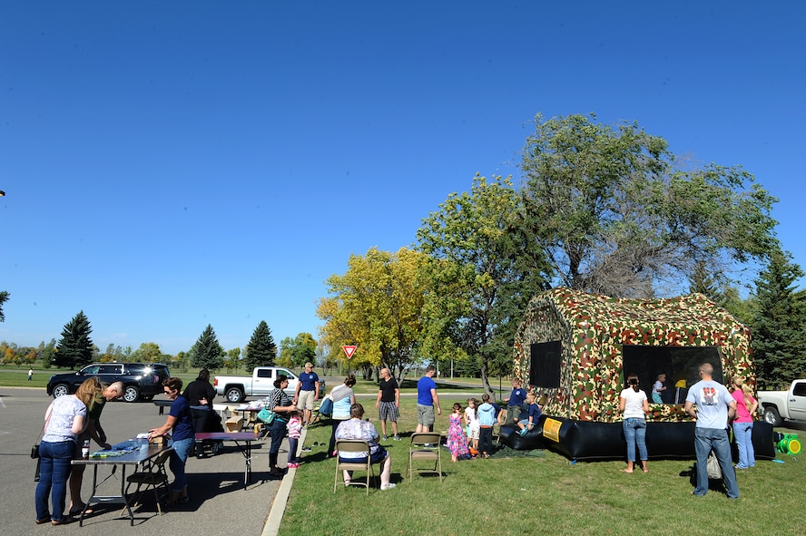 Airmen and their families from Minot Air Force Base participate in different activities at the fall festival at Minot Air Force Base, N.D. Sept. 26, 2015. The fall festival was hosted by the 91st Missile Wing and had several different fundraising activities for Airmen and their families on the base. (U.S. Air Force photo by Staff Sgt. Chad Trujillo)


