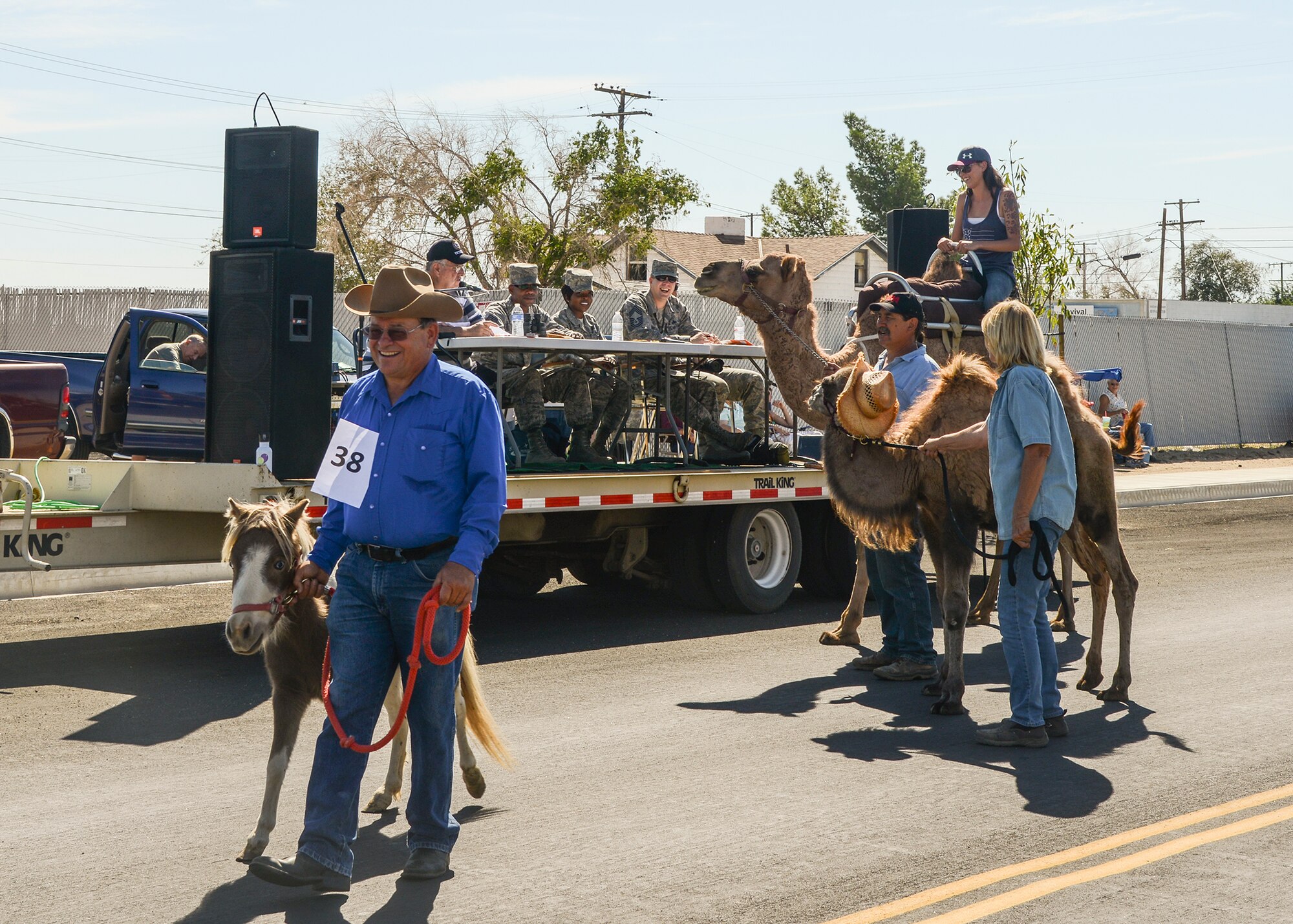 Windswept Ranch approached the judges table to give them a close up look at their camels in the Armed Forces Appreciation Day Parade Sept. 26. The ranch took 3rd place in the “other” category for the parade. (U.S. Air Force photo by Rebecca Amber)