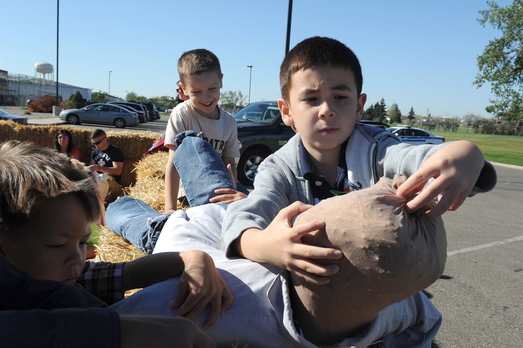 Alex Bliss builds his own scarecrow at the fall festival at Minot Air Force Base, N.D. Sept. 26, 2015. The fall festival was hosted by the 91st Missile Wing and had several different fundraising activities for Airmen and their families on the base. (U.S. Air Force photo by Staff Sgt. Chad Trujillo) 


