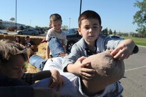 Alex Bliss builds his own scarecrow at the fall festival at Minot Air Force Base, N.D. Sept. 26, 2015. The fall festival was hosted by the 91st Missile Wing and had several different fundraising activities for Airmen and their families on the base. (U.S. Air Force photo by Staff Sgt. Chad Trujillo) 


