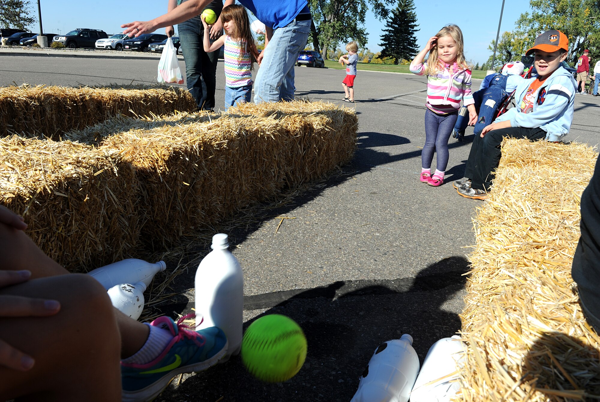 Qwynn Trujillo plays a bowling game at the fall festival at Minot Air Force Base, N.D. Sept. 26, 2015. The fall festival was hosted by the 91st Missile Wing and had several different fundraising activities for Airmen and their families on the base. (U.S. Air Force photo by Staff Sgt. Chad Trujillo) 