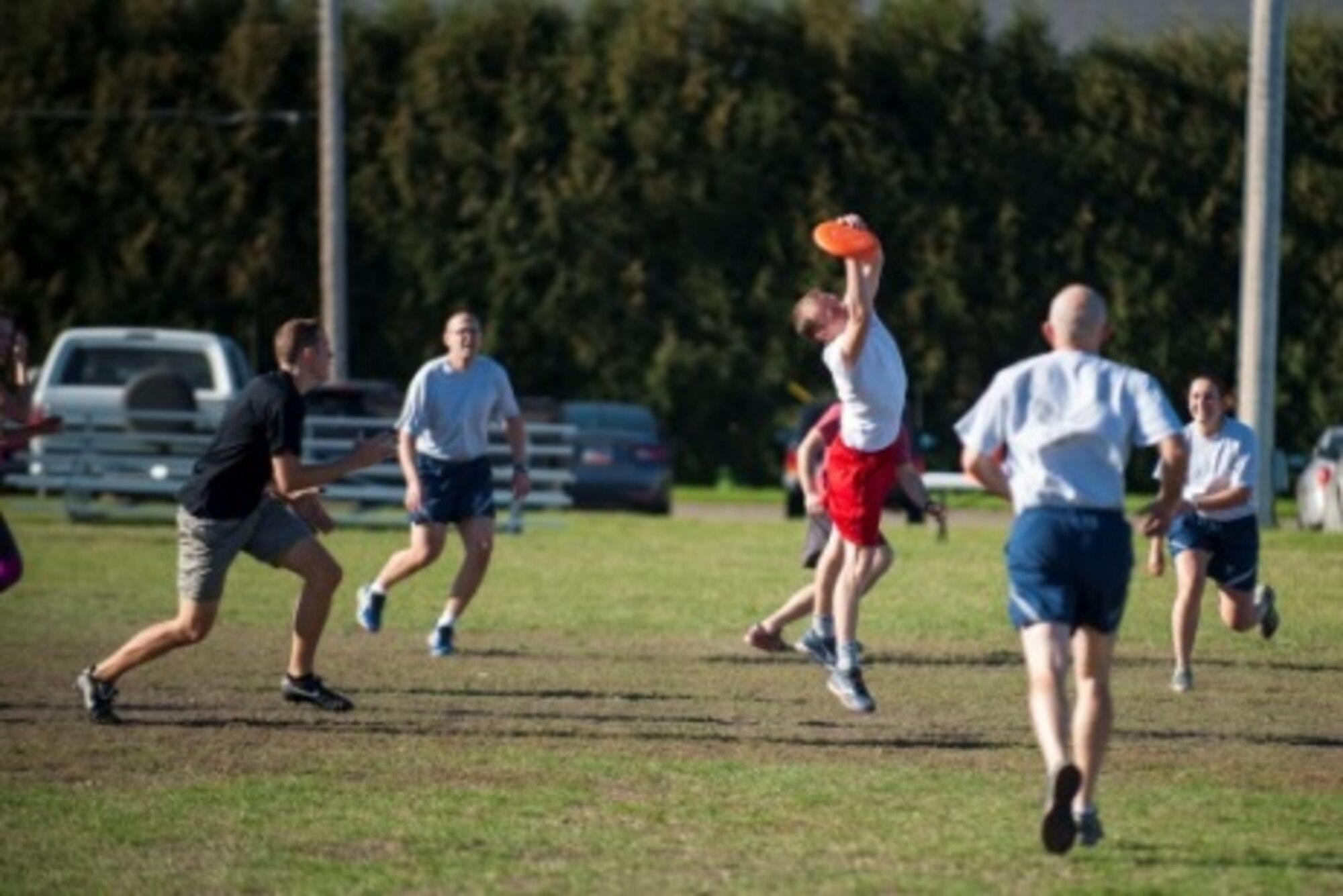 A Minot Airmen catches a Frisbee during sports day at Minot Air Force Base, N.D., Sep. 21, 2015. Sports day was held in honor of Wingman Week, which is a week set aside for shops to come together and work as a team. (U.S. Air Force photo/Airman 1st Class Christian Sullivan)