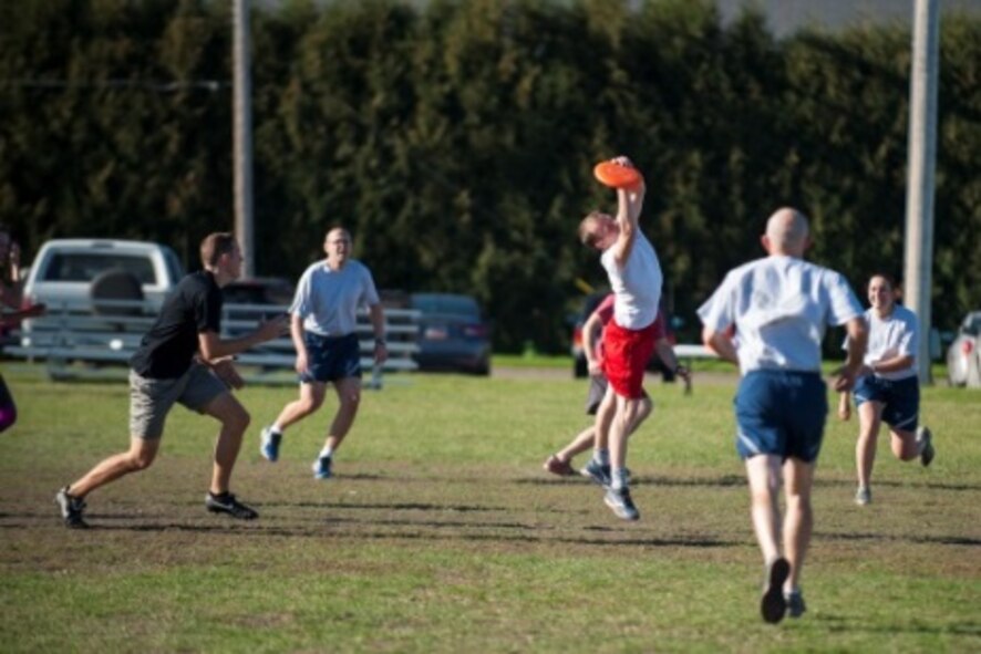 A Minot Airmen catches a Frisbee during sports day at Minot Air Force Base, N.D., Sep. 21, 2015. Sports day was held in honor of Wingman Week, which is a week set aside for shops to come together and work as a team. (U.S. Air Force photo/Airman 1st Class Christian Sullivan)