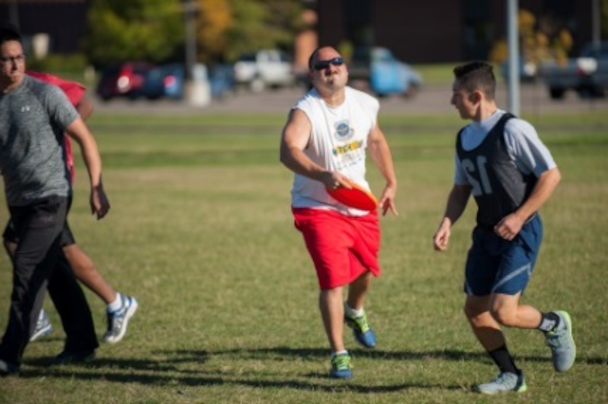 A Minot Airmen throws a Frisbee during sports day at Minot Air Force Base, N.D., Sep. 21, 2015. Ultimate Frisbee was one of many events held for sports day, which consisted of several team events throughout the day that helped promote wingmanship and team-building exercises. (U.S. Air Force photo/Airman 1st Class Christian Sullivan)