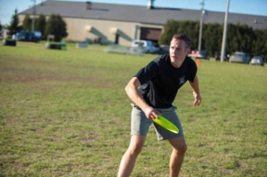 A Minot Airmen throws a Frisbee during sports day at Minot Air Force Base, N.D., Sep. 21, 2015. Ultimate Frisbee was one of many events held for sports day, which consisted of several team events throughout the day that helped promote wingmanship and team-building exercises. (U.S. Air Force photo/Airman 1st Class Christian Sullivan)