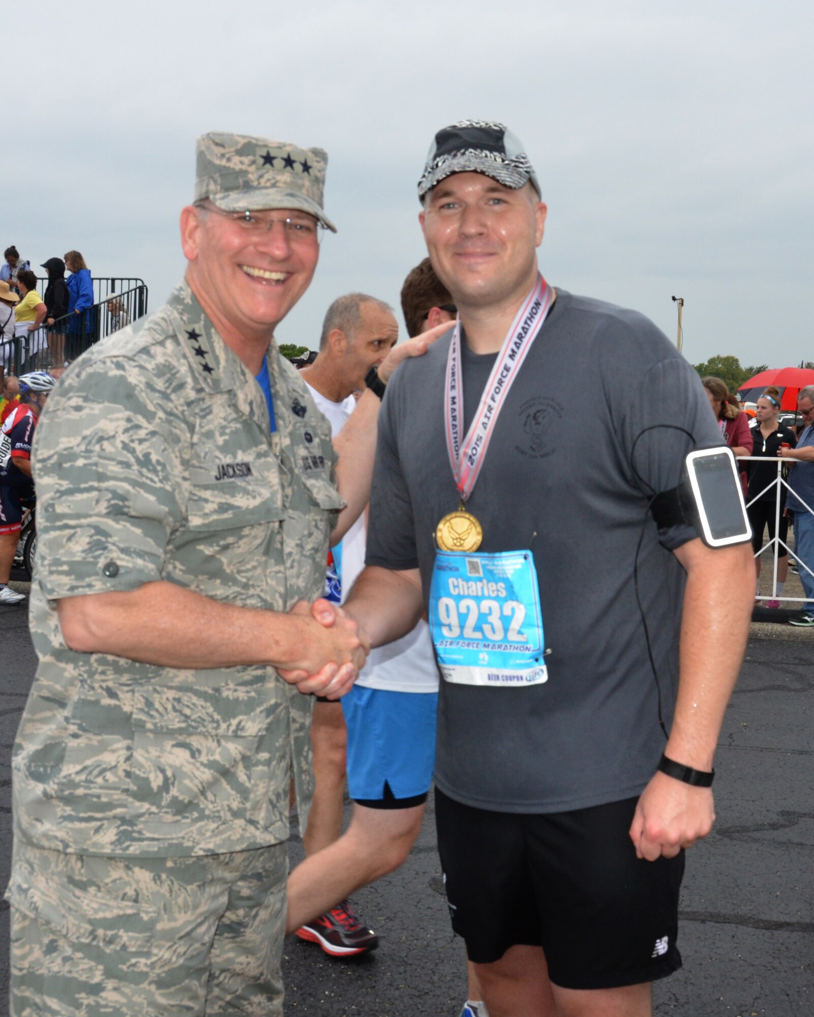 WRIGHT-PATTERSON AIR FORCE BASE, Ohio – Lt. Gen. James F. Jackson, the commander of the AFRC, awards a medal to Maj. Charles Trovarello, 445th Security Forces Squadron commander, after he crossed the finish line in the 19th Annual Air Force Marathon held Sept. 19, 2015. Trovarello’s time was 2:17:06. (U.S. Air Force photo/Lt. Col. Cynthia Harris)