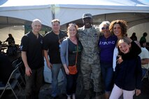 Col. Rodney Lewis, 319th Air Base Wing commander, visits with base and community members at the UND Military Appreciation Day event Sept. 26, 2015 in Grand Forks, North Dakota. Guests were treated to a tailgate party ahead of the matchup between the University of North Dakota and the University of California, Davis. (U.S. Air Force photo/Staff Sgt. Susan L. Davis)