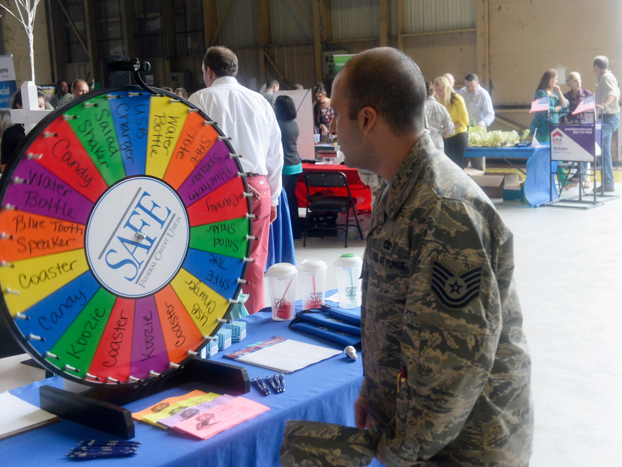 A U.S. Air Force Airman spins a prize wheel during the 7th Annual Military Appreciation Picnic at Shaw Air Force Base, S.C., Sept. 25, 2015. During the picnic Airmen received goodies and information about the businesses in the local area. (U.S. Air Force photo by Airman 1st Class Christopher Maldonado/Released)