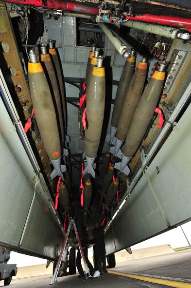 Members of the 69th Bomb Squadron inspect munitions before a bombing mission at Minot Air Force Base, N.D., Sept. 23, 2015. The mission involved the dropping of ordnance on predetermined practice targets. The 69th BS is tasked with both conventional and nuclear mission sets, and maintains the capability to perform both mission sets simultaneously. (U.S. Air Force photo/Senior Airman Stephanie Morris)