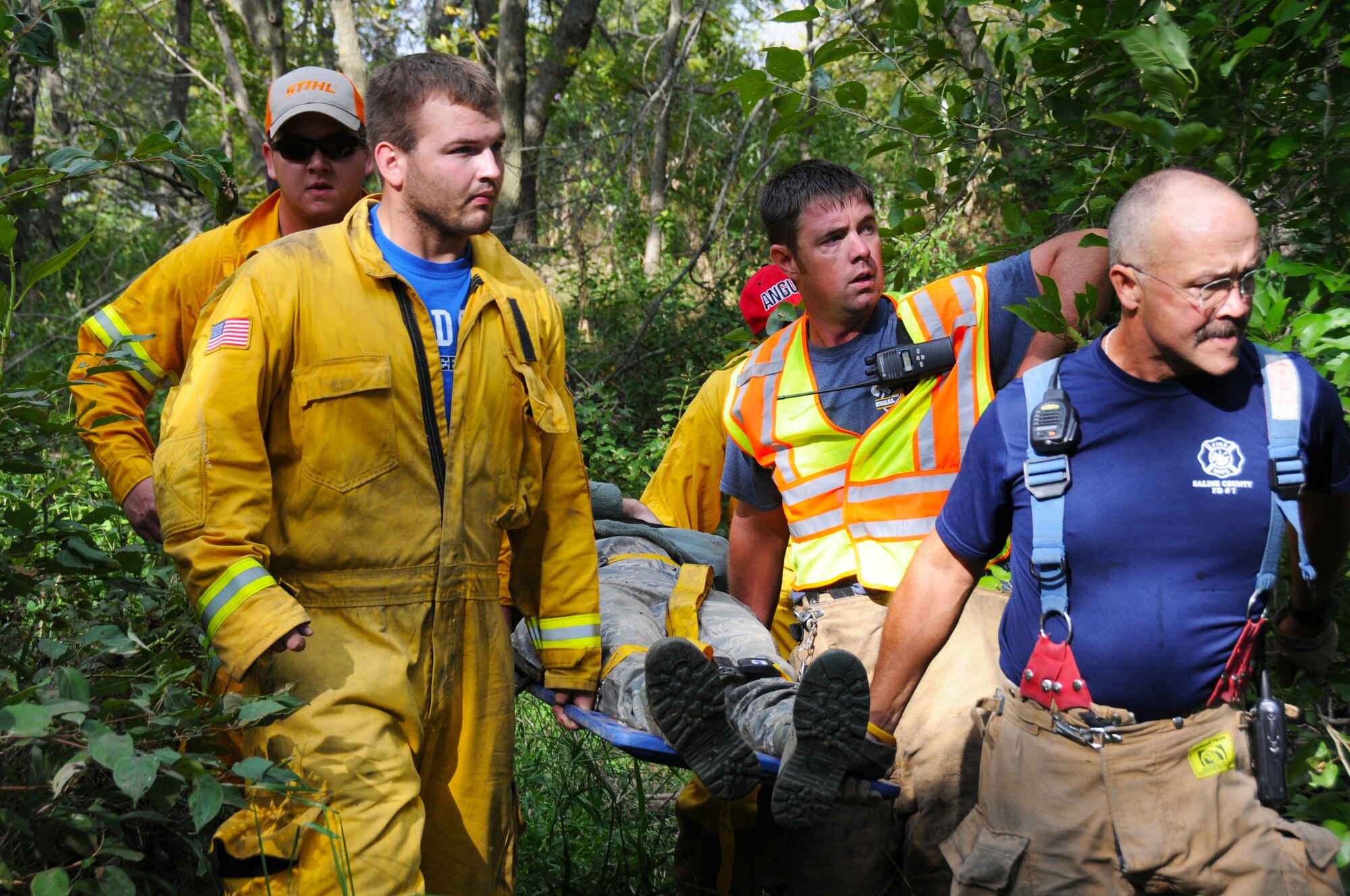 Volunteer rescue personnel from several Saline County districts conduct a search and recovery mission and extract casualties around an airplane crash site during an exercise at Smoky Hill Weapons Range Sept. 12. (Photo by Master Sgt. Matt McCoy, 184th Public Affairs)