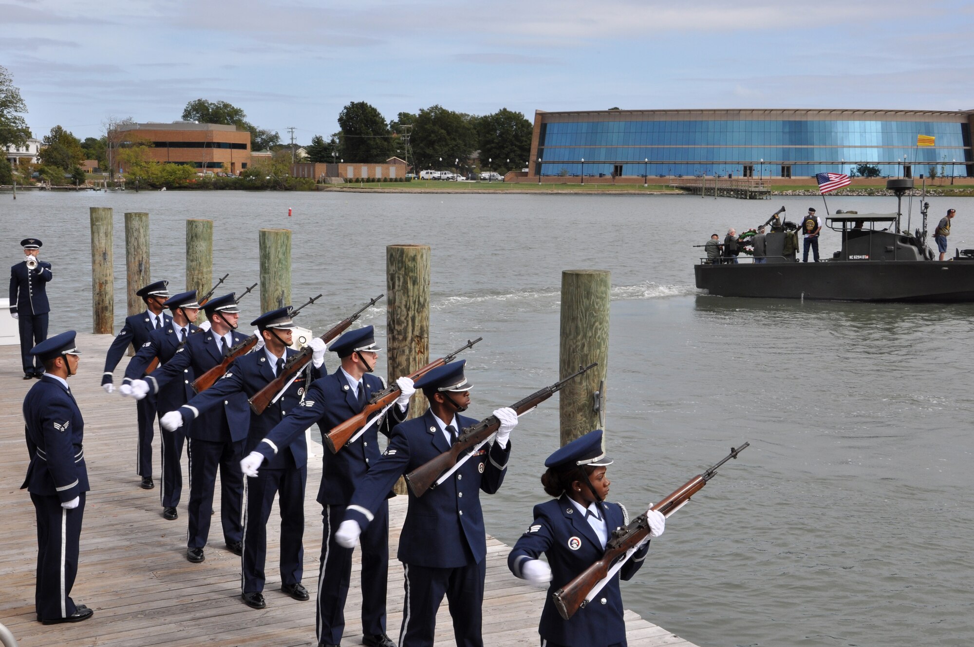 Members of the Langley Air Force Base Honor Guard perform a 21-gun salute during the 458th Sea Tigers 2015 Reunion Memorial ceremony at the Hampton Maritime Center in Hampton, Va., Sept. 24, 2015. U.S. Service members from Joint Base Langley-Eustis and Naval Weapons Station Yorktown performed various details during the memorial ceremony. (U.S. Air Force photo by Master Sgt. April Wickes/Released)