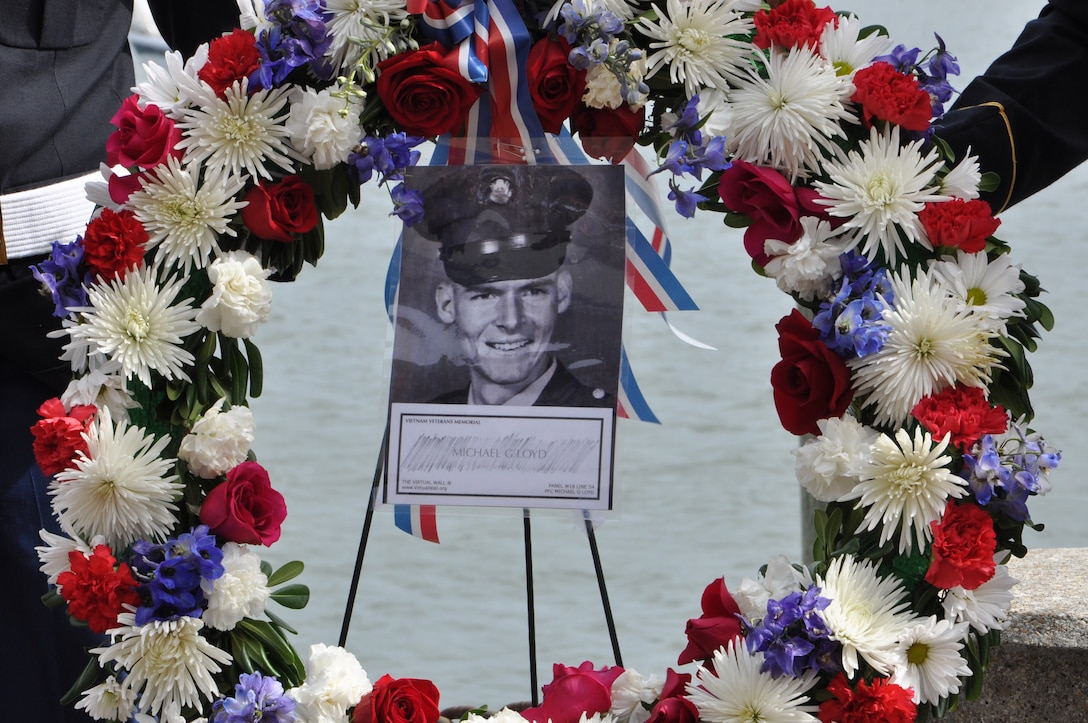 An image of U.S. Army Pfc. Michael Glenn Loyd is displayed on a wreath during the 458th Sea Tigers 2015 Reunion Memorial ceremony at the Hampton Maritime Center in Hampton, Va., Sept. 24, 2015. The wreath was carried away on a river patrol boat and laid on the Hampton River in memory of Loyd. (U.S. Air Force photo by Master Sgt. April Wickes/Released)