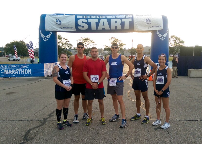 Airman 1st Class Jessica Rodriguez, 436th Operations Support Squadron air traffic control apprentice, far right, poses for a photo with the Air Mobility Command team prior to the start of the 19th Air Force Half Marathon Sept. 19, 2015, at Wright-Patterson Air Force Base, Ohio. Each Major Command sent a team consisting of two female and four male athletes and Rodriguez was the only Airman from Team Dover selected to be on the AMC team. (Courtesy photo)