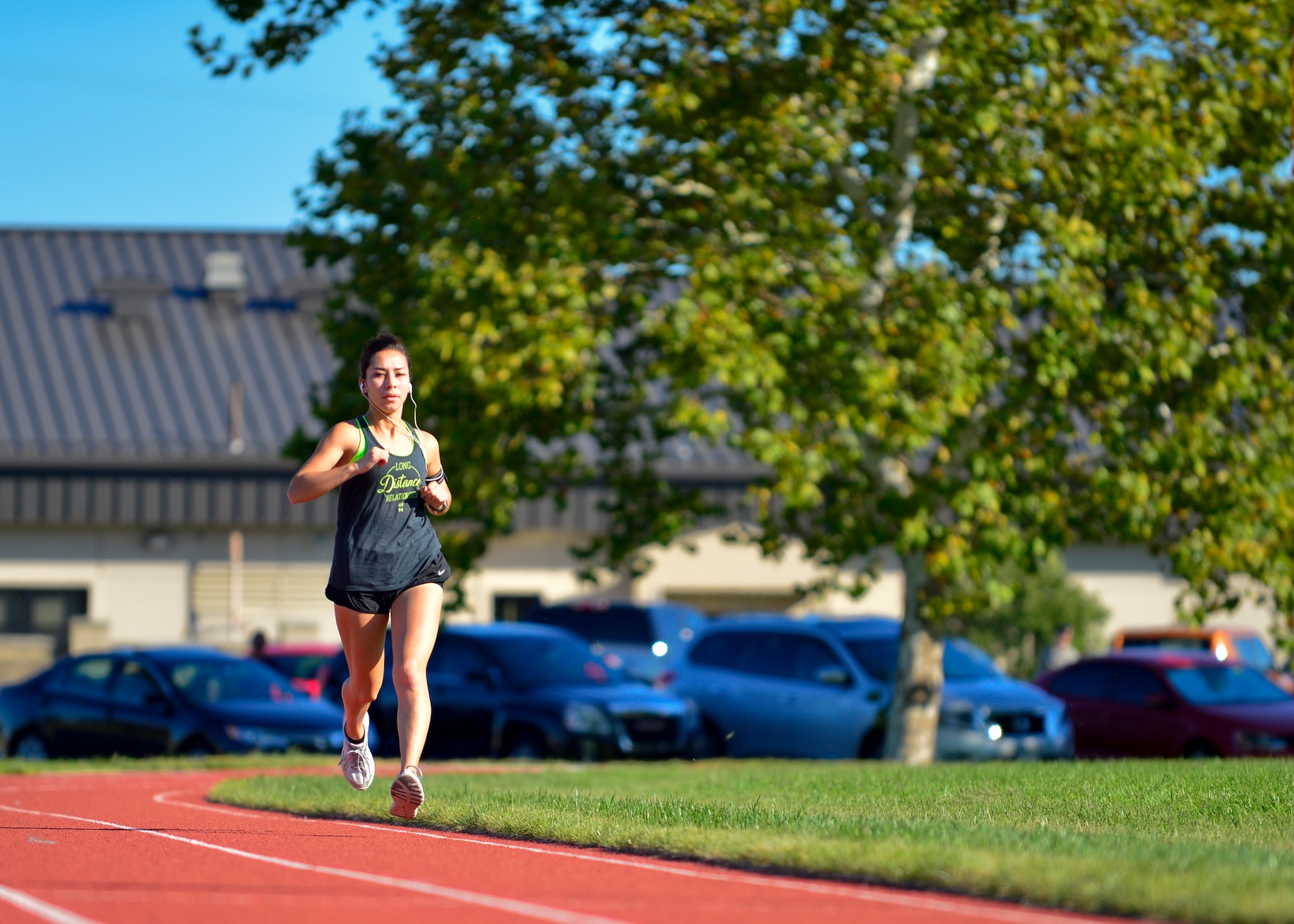 Airman 1st Class Jessica Rodriguez, 436th Operations Support Squadron air traffic control apprentice, runs around the new base track while training for the 19th Air Force Half Marathon Sept. 14, 2015, at Dover Air Force Base, Del. Rodriguez was the only Airman from Team Dover selected to run in the half marathon race. (U.S. Air Force photo/Senior Airman William Johnson) 