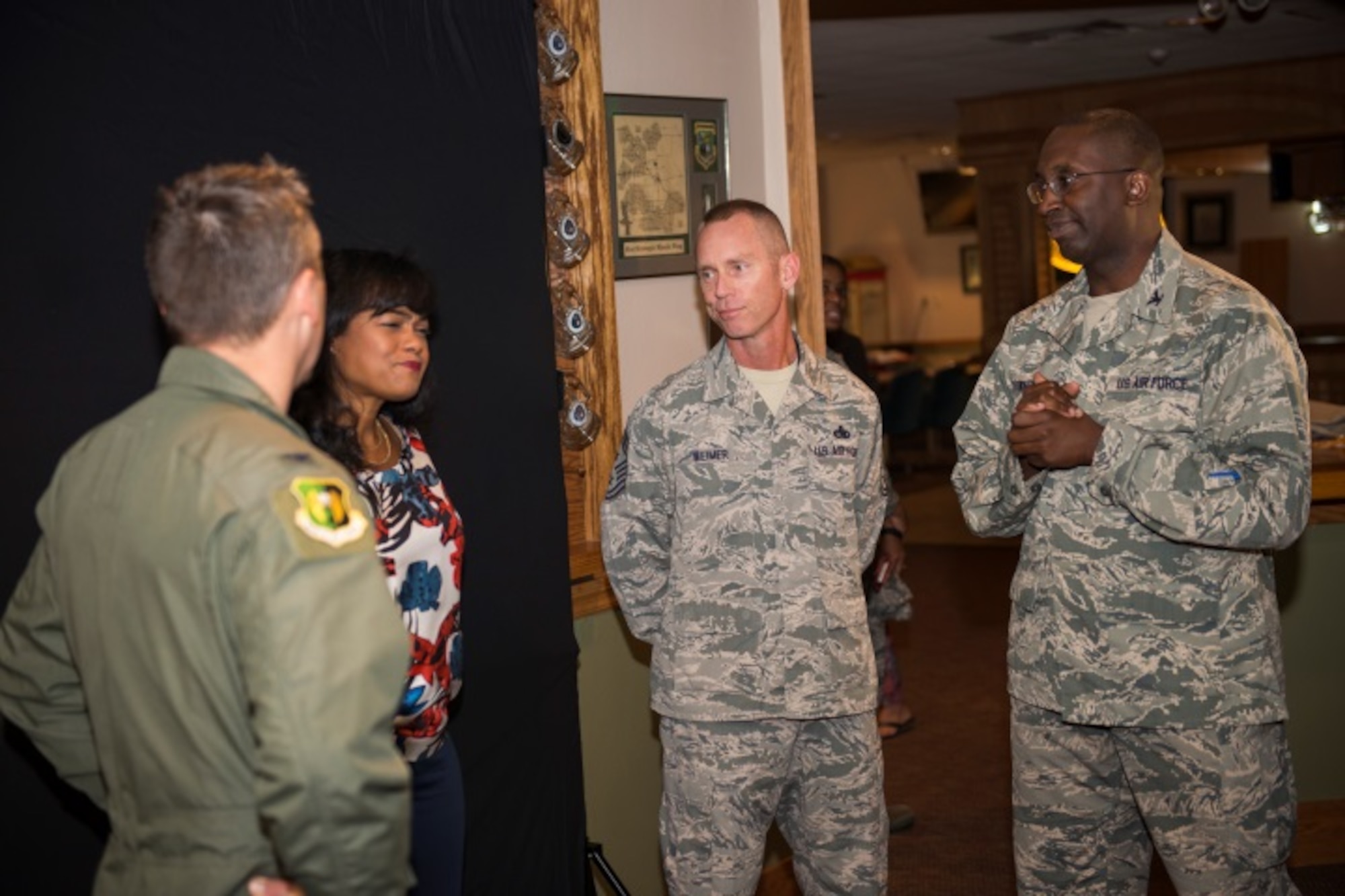 Tatyana Ali, actress, speaks to Col. Jason Armagost, 5th Bomb Wing commander, Chief Master Sgt. Geoff Weimer, 5th Bomb Wing command chief, and Col. Kelvin Townshend, 91st Missile Wing vice commander, at the Jimmy Doolittle Center at Minot Air Force Base, N.D, September 21, 2015. Ali is a Harvard graduate and spoke to Airmen about her own struggles to reach goals, including her struggle with depression in college. (U.S. Air Force photo/Airman 1st Class Justin T. Armstrong)