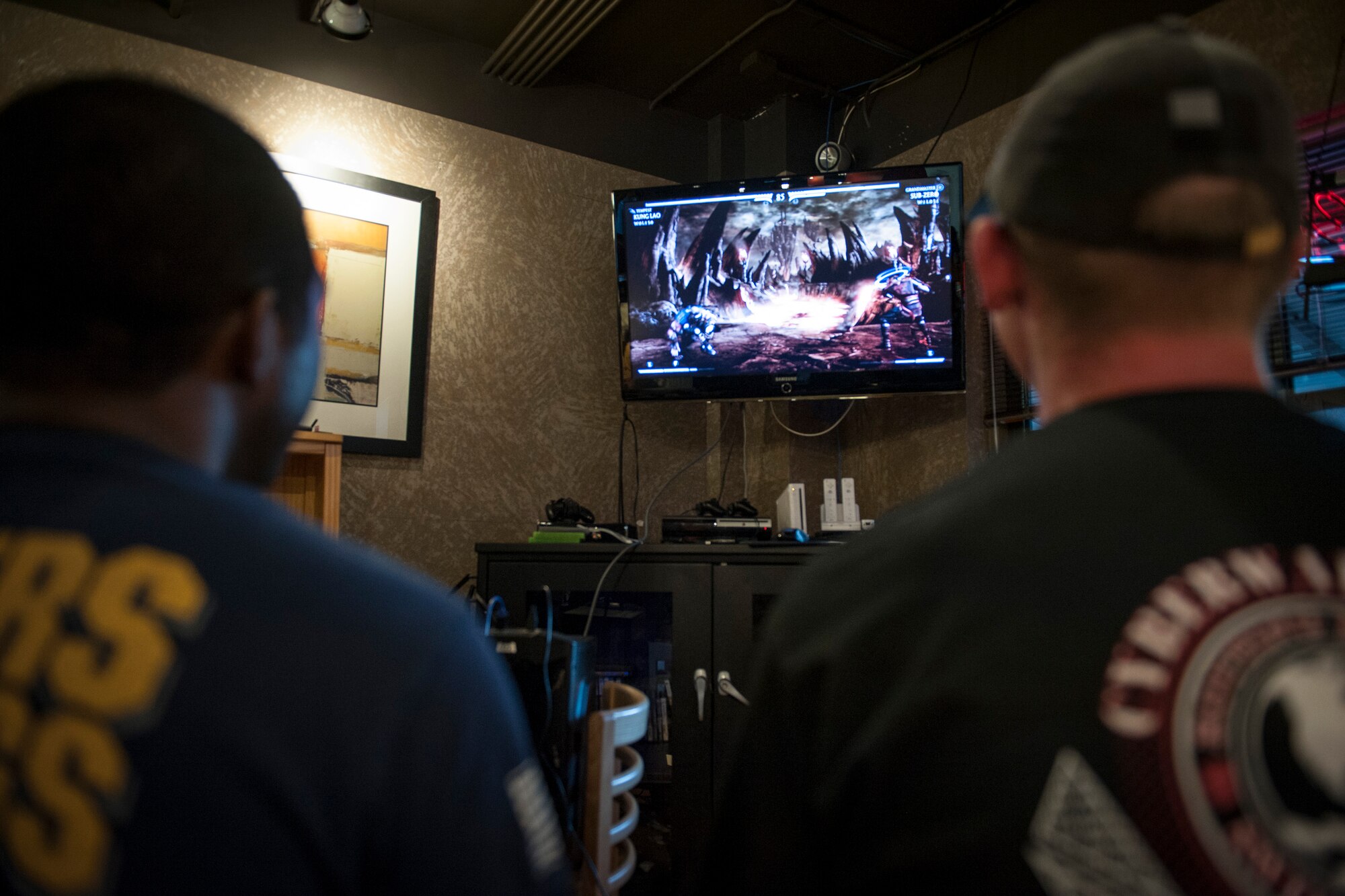 PETERSON AIR FORCE BASE, Colo. – Two Peterson Airmen battle it out in the virtual world during the first ever Mortal Kombat Exhibition Tournament, Sept. 26, 2015 at the Eclipse Cyber Café. Before competing, the 24 participating Airmen received a resiliency training lesson to make sure the virtual violence doesn’t become a real-world problem. The winners were: Airman 1st Class Hersey Mayo, 21st Aerospace Medicine Squadron, first place; Senior Airman Shaquil Hickman, 21st Force Support Squadron, second place; and Airman 1st Class Christian McDonald, 50th Space Communications Squadron, third place. (U.S. Air Force photo by Airman 1st Class Rose Gudex)
