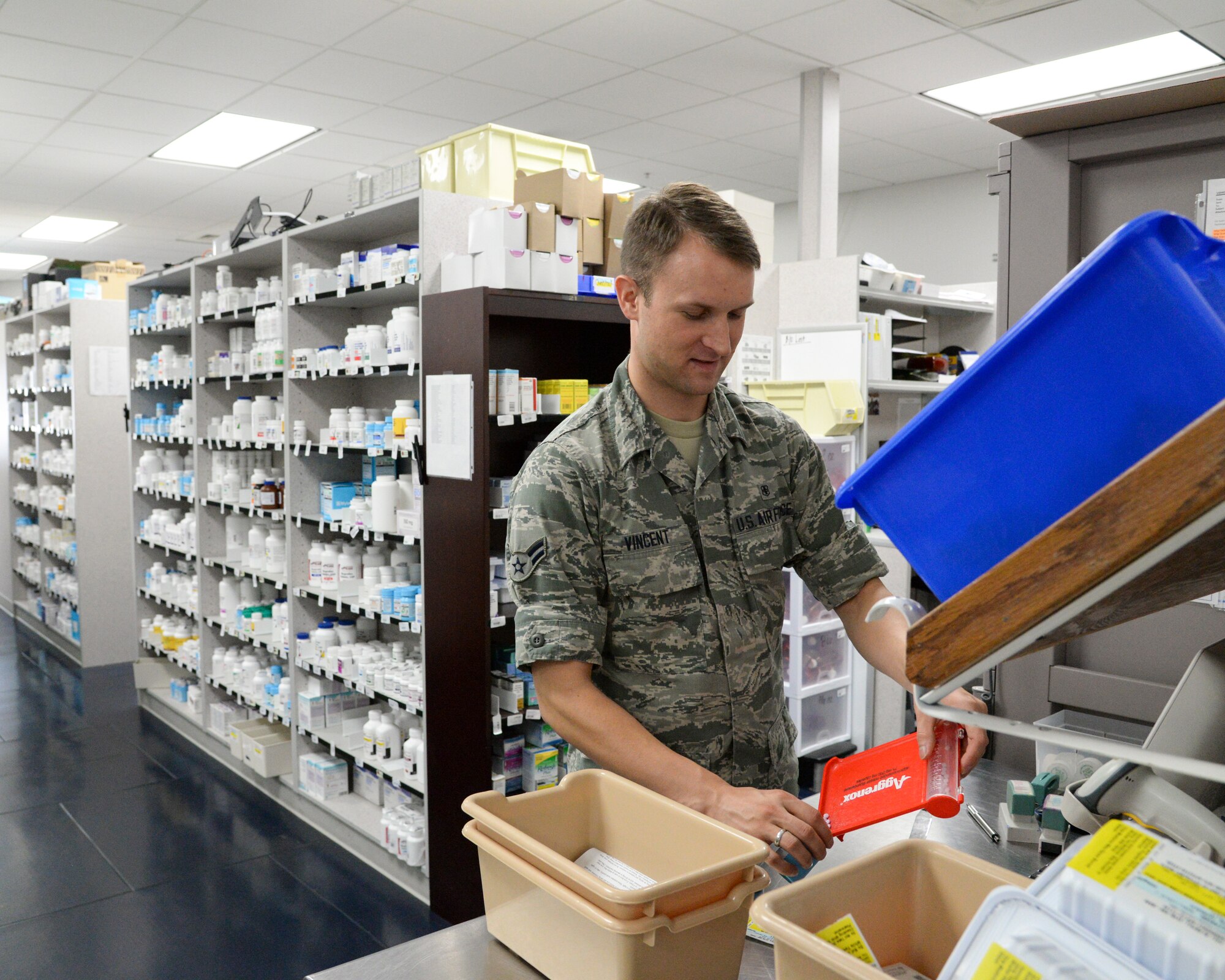 Airman 1st Class Cameran Vincent, 2nd Medical Support Squadron narcotics custodian, fills a prescription at Barksdale Air Force Base, La., Sept. 24, 2015. Both pharmacies fill over 270,000 prescriptions a year. (U.S. Air Force photo/Senior Airman Jannelle Dickey)
