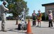 Airman 1st Class Chris Simpson, 22nd Civil Engineering Squadron explosive ordnance disposal apprentice, demonstrates how EOD would get rid of an improvised explosive device using a robot, Sept. 26, 2015, at McConnell Air Force Base, Kan. The EOD flight was one of the many units around base who provided a working demonstration for Team McConnell family members for the annual family mobility line held on base. (U.S. Air Force photo by Senior Airman Colby L. Hardin)