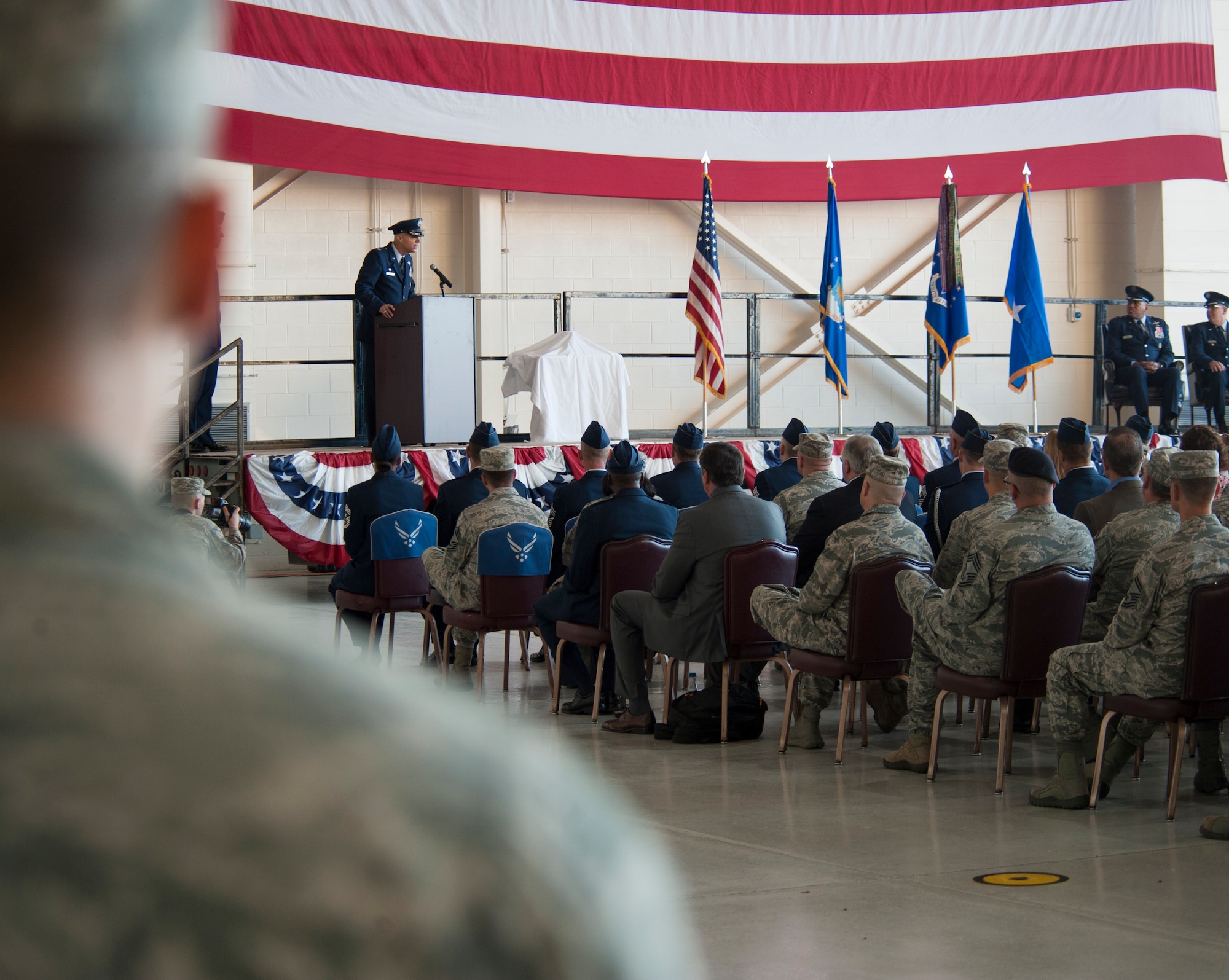 U.S. Air Force Col. Michael Bob Starr, 7th Bomb Wing commander, speaks to an audience during a ceremony to commemorate the realignment of the 7th BW to Air Force Global Strike Command Sept. 28, 2015, at Dyess Air Force Base, Texas. B-1B Lancers from the 7th BW and Ellsworth AFB’s 28th BW will be joining with B-52H Stratofortresses and B-2 Spirits already residing within 8th Air Force, strengthening the U.S. Air Force’s entire long range strike fleet. (U.S. Air Force photo by Airman 1st Class Katherine Miller/Released)