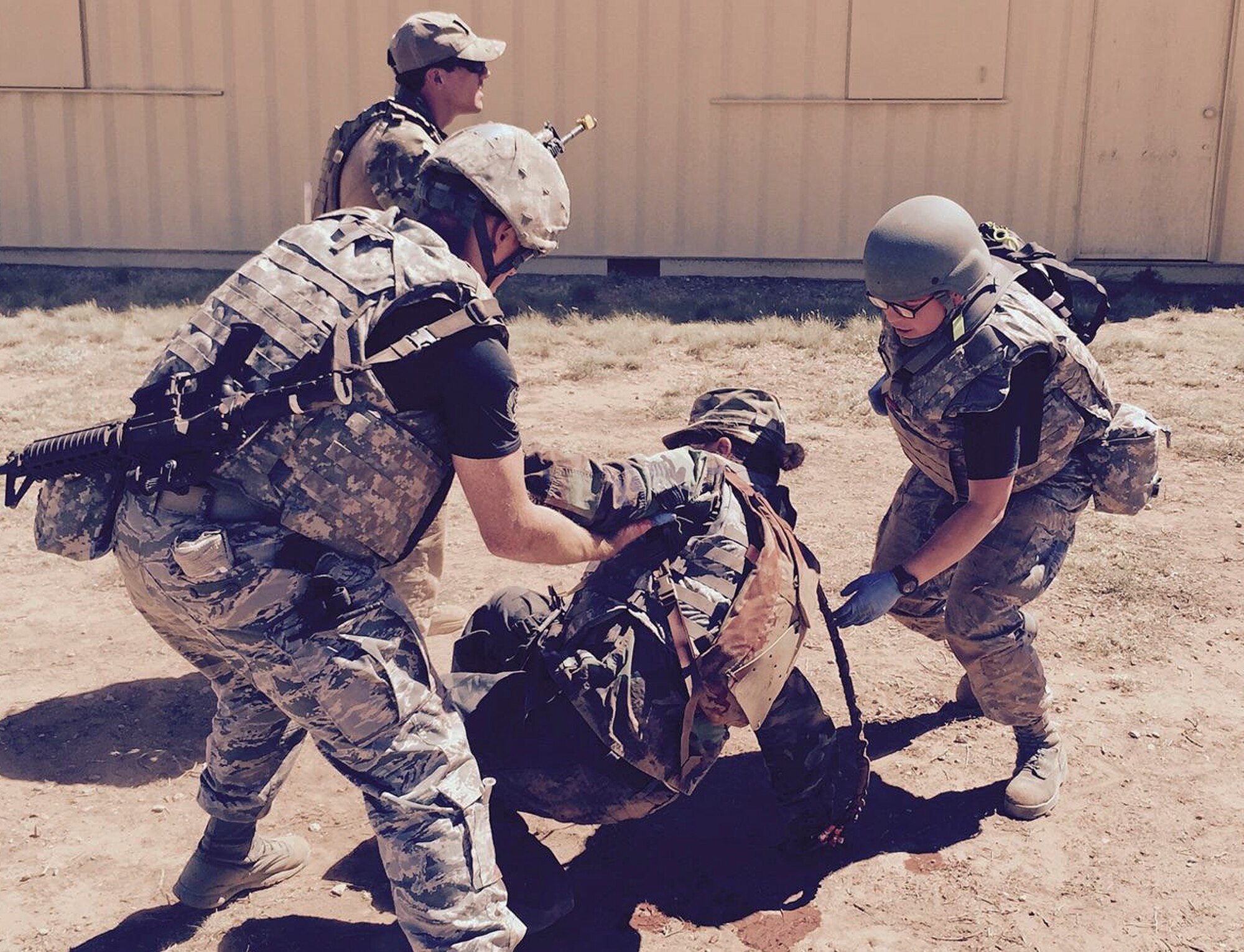 Staff Sgt. Billie Houghton and Senior Airman Kayle Carr, 96th Medical Group, help a simulated wounded Airman to her feet during the recent Emergency Medical Technician Rodeo held a Cannon Air Force Base, N.M.  A team of five EMTs from Eglin were able to attend the rodeo for the first time this year.  (Courtesy photo)