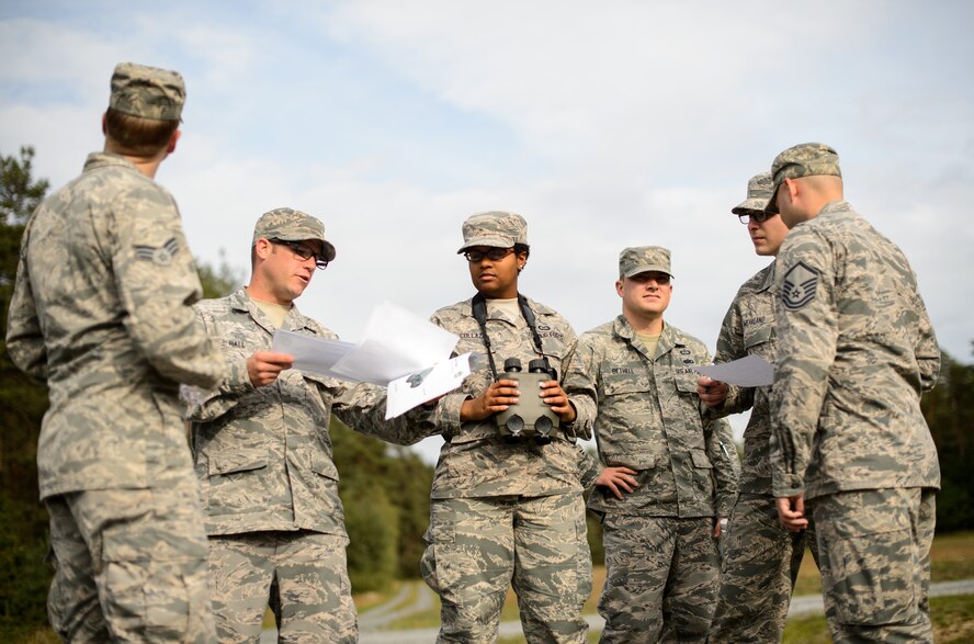 Airmen from the 7th Weather Squadron prepare to build a tactical visibility chart during exercise Cadre Focus 2015 Sept. 16, 2015, at Grafenwohr Training Area, Germany. A visibility chart allows Airmen to build an accurate picture of their surroundings when visibility is low. Approximately 30 Airmen took part in Cadre Focus 2015, an exercise designed to improve their weather forecasting and Army combat skills. (U.S. Air Force photo/Staff Sgt. Armando A. Schwier-Morales)