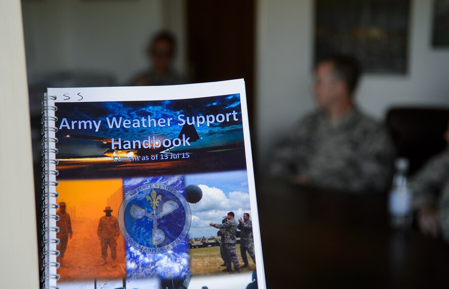 Battlefield weather Airmen discuss their new handbook during their annual Cadre Focus training Sept. 17, 2015, at Grafenwohr Training Area, Germany. Cadre Focus 2015 put a new emphasis on Eastern Europe and working alongside the Army for the 7th Weather Squadron. (U.S. Air Force photo/Staff Sgt. Armando A. Schwier-Morales)