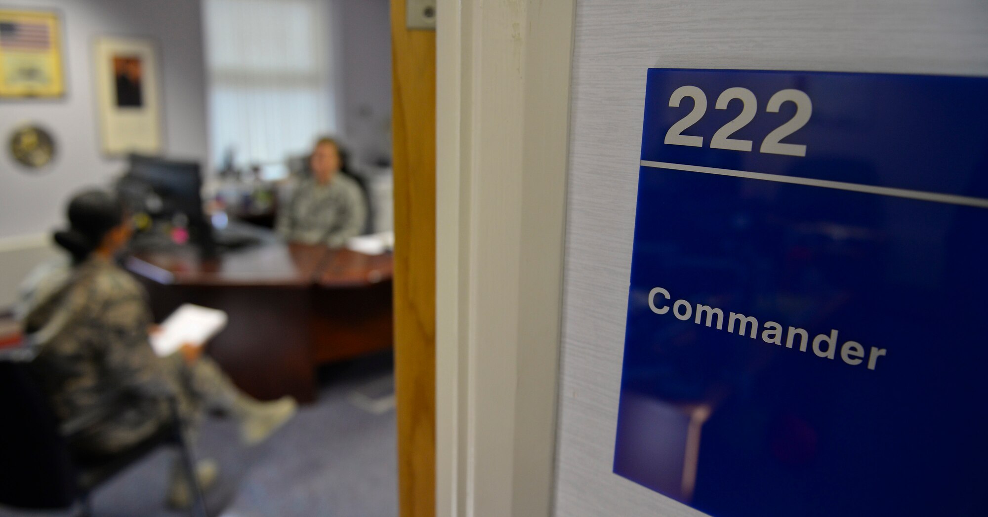 A U.S. Air Force flight commander talks with one of her Airmen Sept. 29, 2015, on RAF Mildenhall, England. The professional development center on RAF Mildenhall offered a two-day course for flight commanders Sept. 24 and 25. The course focused on leadership, management and supervisory skills. (U.S. Air Force photo by Staff Sgt. Micaiah Anthony/Released)