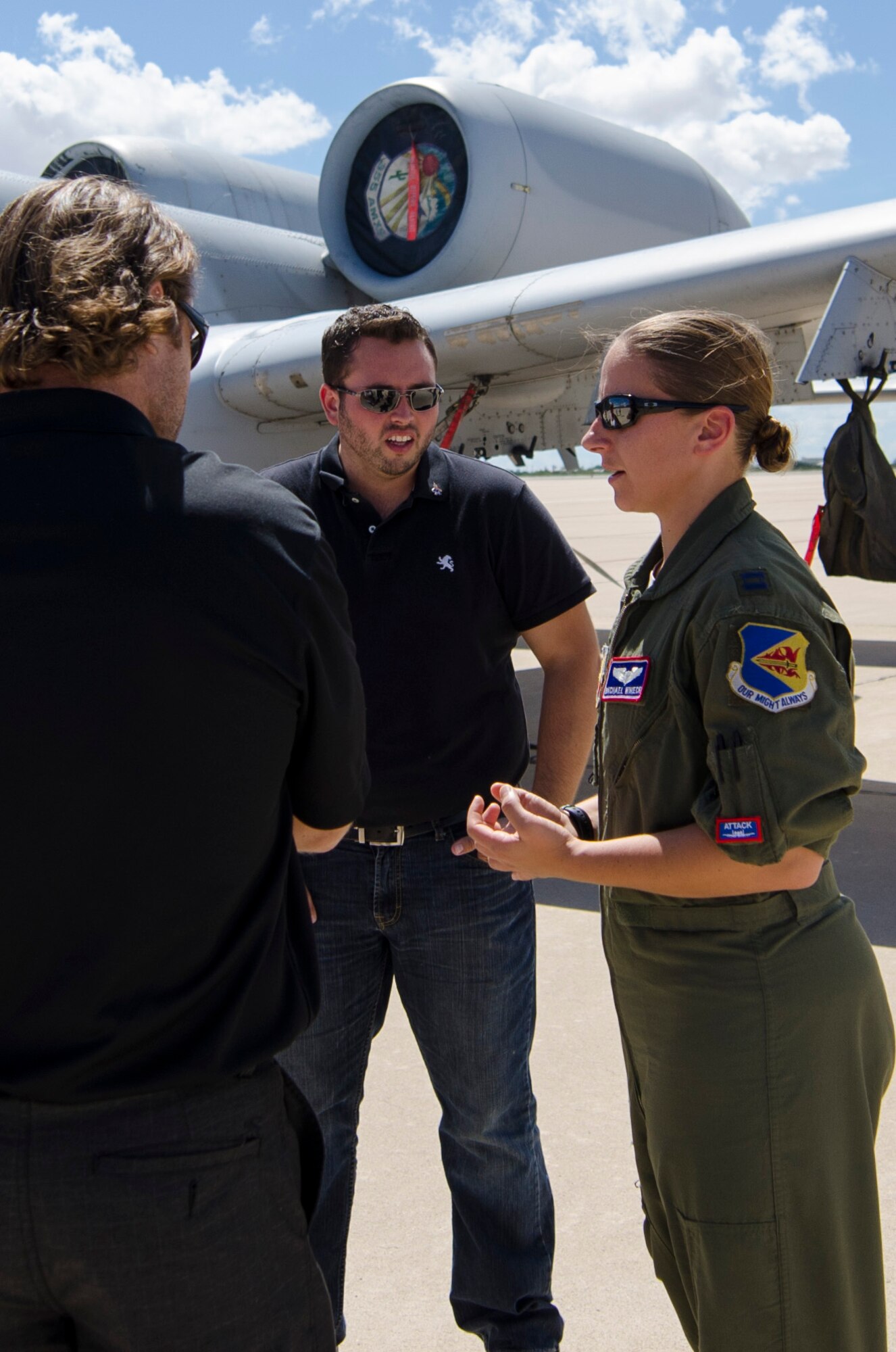 Team Dover Honorary Commanders, speak with Capt. Rachael Winiecki, an A-10 Warthog pilot, during a Civic Leader Tour, Sept. 16 on Luke Air Force Base, Ariz. CRTs are designed to engage local leaders from the Dover community with unique missions from different military bases outside of the Air Mobility Command. (U.S. Air Force photo by Capt. Bernie Kale)