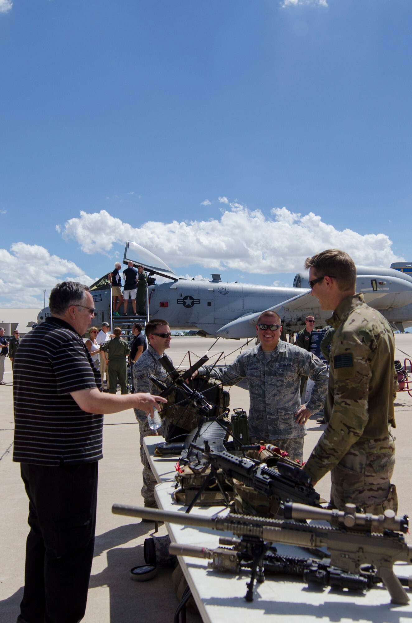 A community leader (left) from Dover, Del., speaks with pararescue and communications personnel during a Civic Leader Tour, Sept. 16 on Luke Air Force Base, Ariz. CRTs are designed to engage local leaders from the Dover community with unique missions from different military bases outside of the Air Mobility Command. (U.S. Air Force photo by Capt. Bernie Kale)